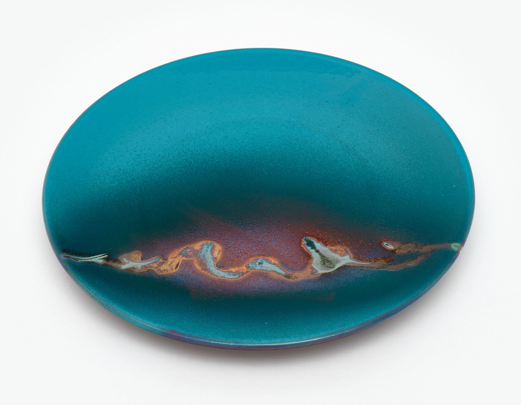 Charger from Vallauris, France made of glazed ceramic. This piece is signed.