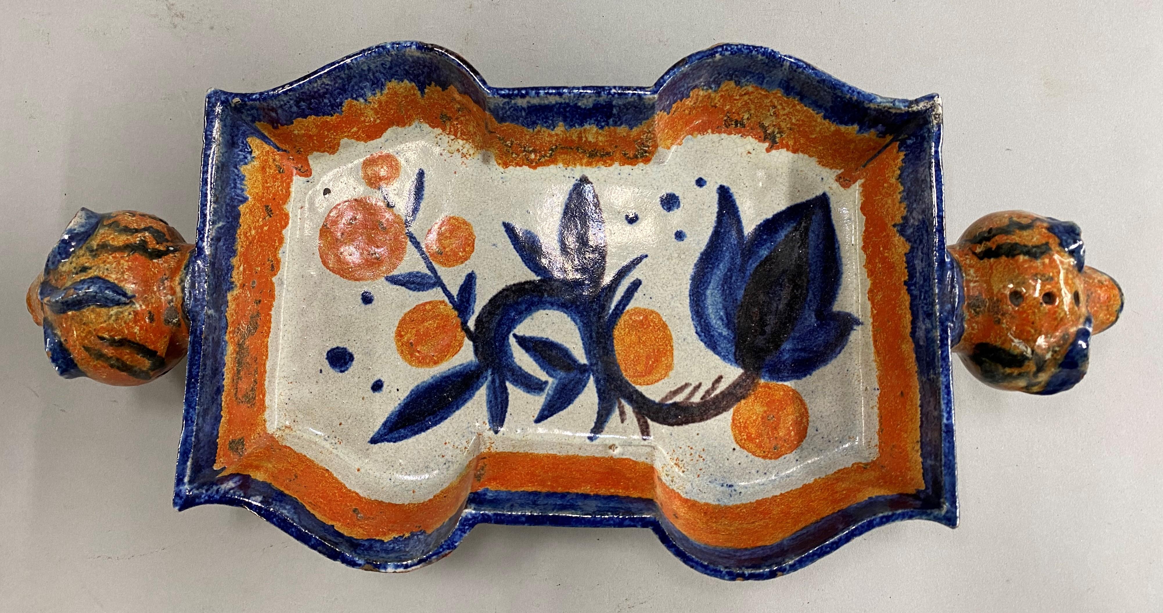 A fine ceramic polychrome centerpiece with animal head handles and bold foliate decoration, by Austrian American ceramic artist Valerie “Vally” Wieselthier (1895-1945) for Wiener Werkstätte, established in 1903 by the graphic designer and painter