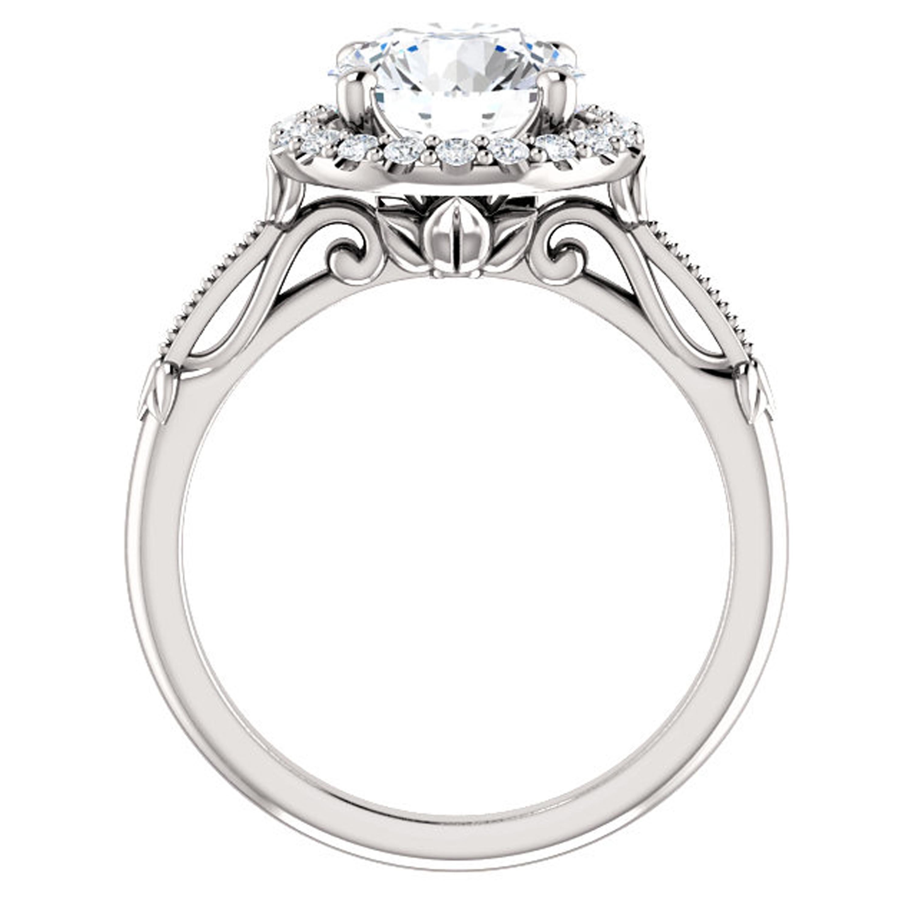 Beautiful filigree detailing adorns the shank and gallery of this halo style engagement ring. Shimmering diamonds full of life surround the halo.

Matching wedding band sold separately.

Center Stone:
1 Round-cut Natural Diamond
Diamond Weight: 0.75