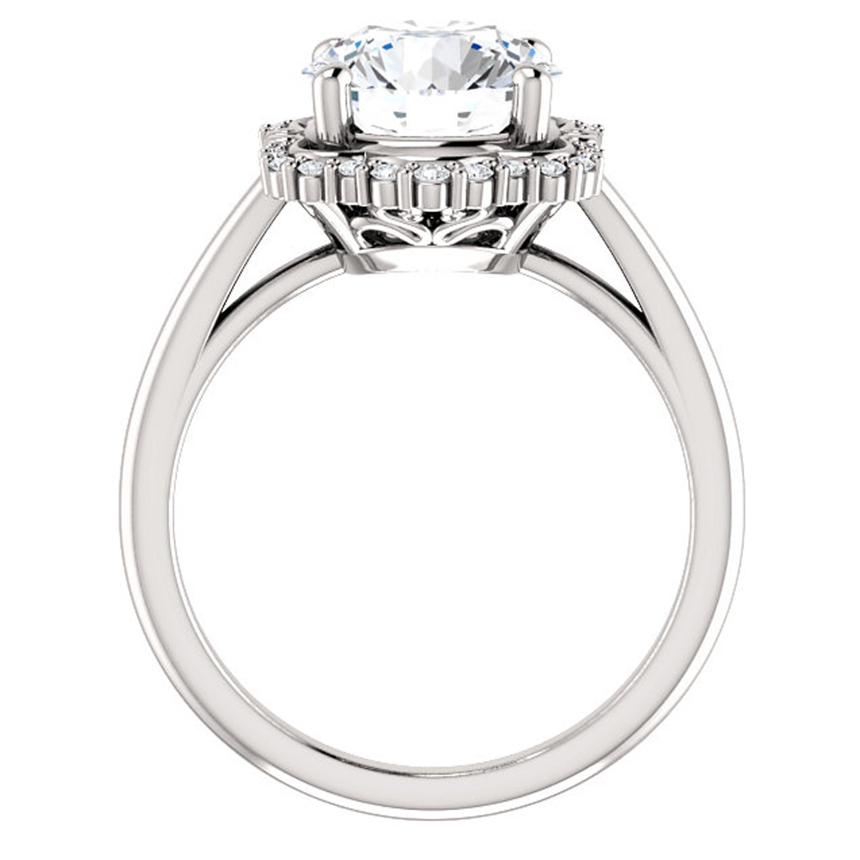 Showcasing a scalloped halo accented with brilliant diamonds, this unique engagement ring features a plain shank. Handcrafted in 14k white gold, this wedding ring shines with luxurious brilliance.

Center Stone:
1 Round Brilliant Natural