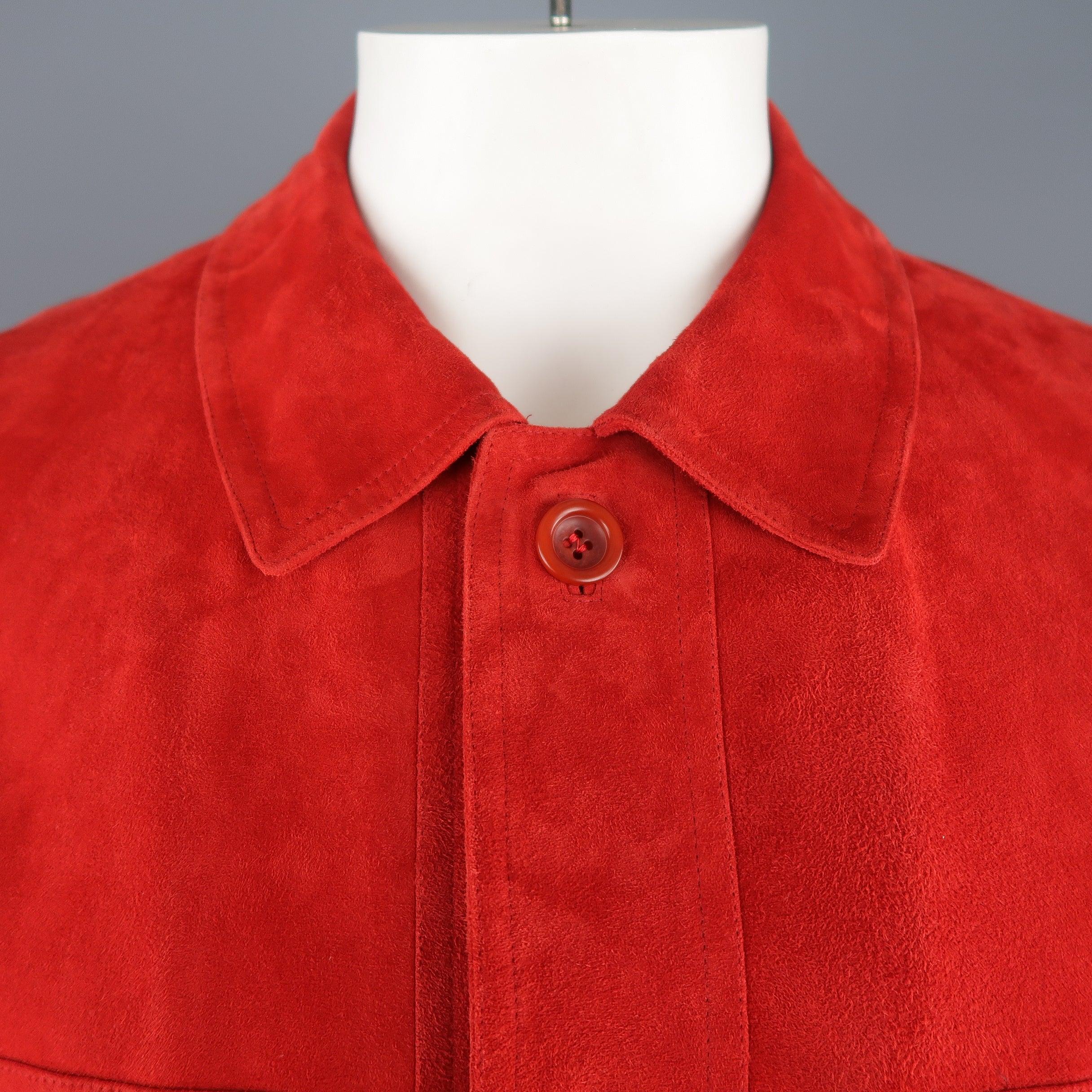 Vintage VALSTAR coat comes in vibrant orange red light weight suede with a pointed collar, button up front, four patch flap pockets, button cuffs, and drawstring waist. A couple small imperfections shown in detail shots. As-is. Made in Italy.
Good