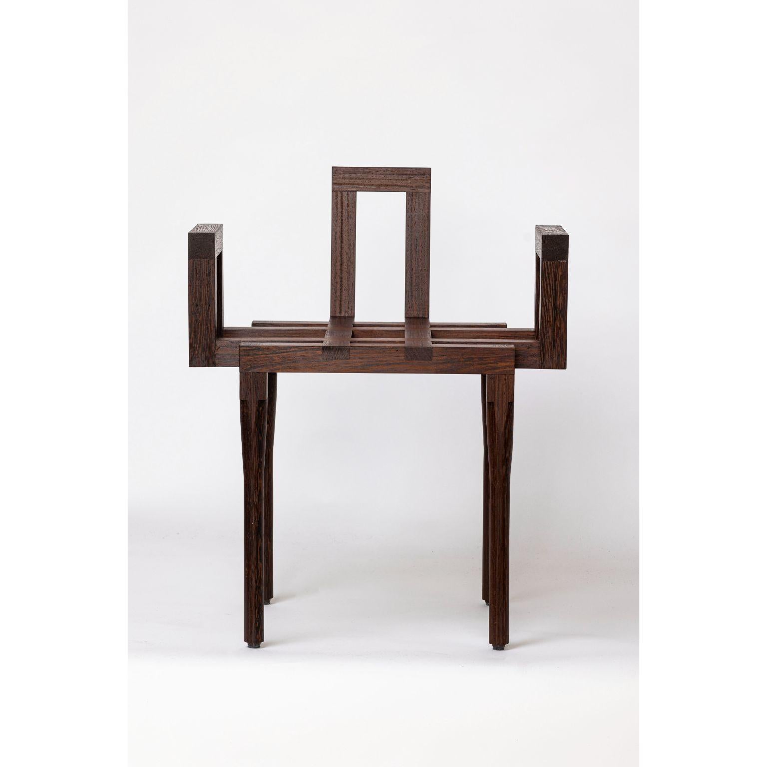 Values comfort chair by Geke Lensink
Dimensions: D 42.5 x W 49.5 x H 69 cm 
Materials: wenge wood 

After graduating from ArtEZ University of the Arts, Geke Lensink started working as an independent interior designer, setting up many exhibitions