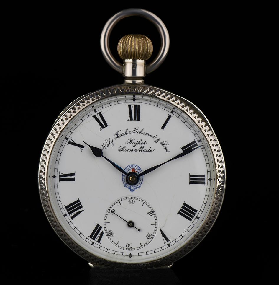 A Silver & Enamel Vintage Pocket Watch, white porcelain dial with roman numerals, small seconds at 6 0'clock, a silver patterned bezel, silver polished inner cuvette case, an enamel portrait of a maharajah on caseback, plastic glass, exhibition
