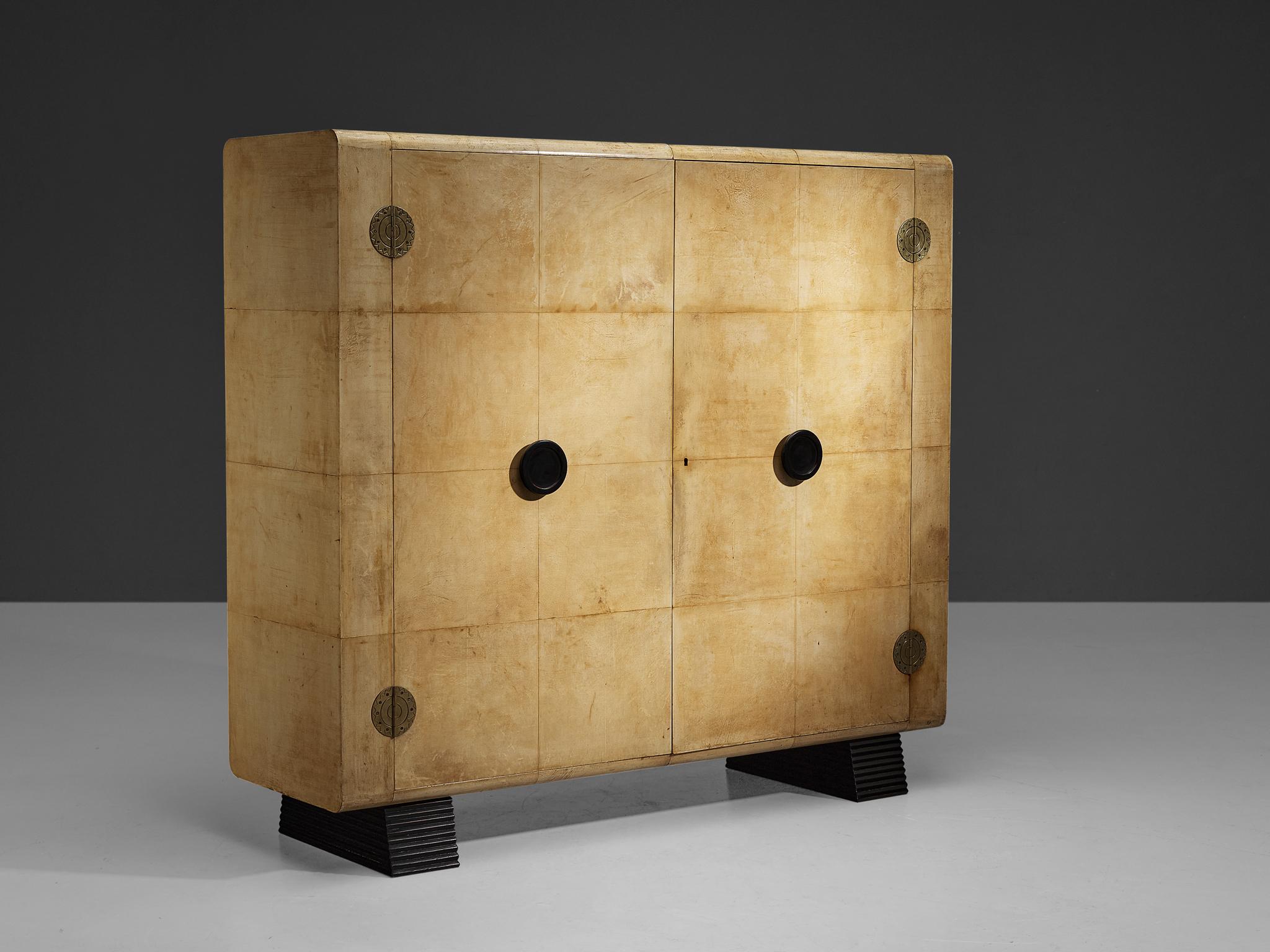 Valzania, armoire, parchment, brass, mahogany, mahogany veneer, ebonized wood, Italy, circa 1935

This grand armoire results from excellent craftsmanship combined with a well-balanced eye for the composition of functional and decorative elements.