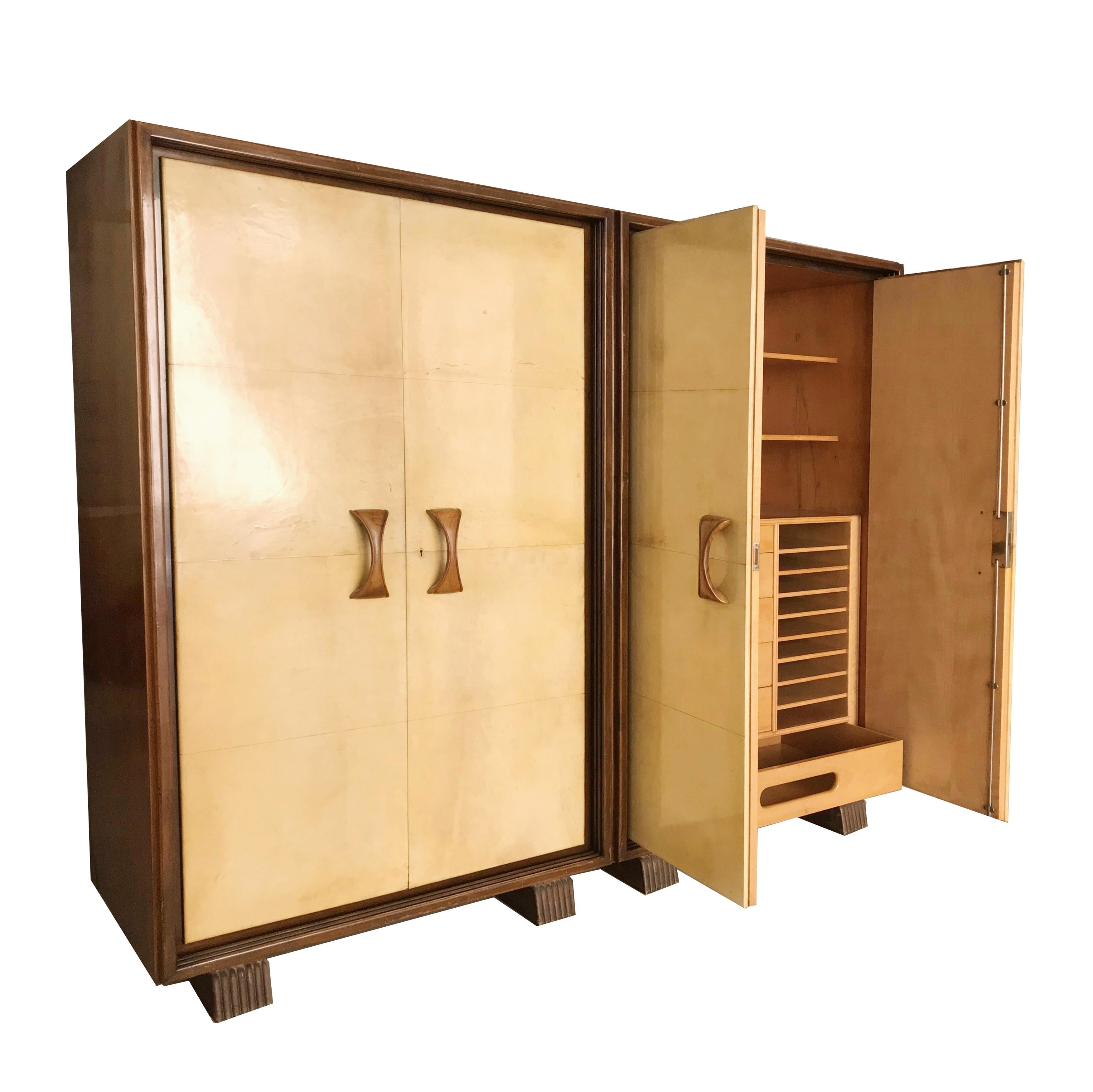 Beautiful wardrobe/cabinet made and signed by Valzania, covered in parchment. A masterpiece of other times, executed by Maestro Valzania. Attributable to Guglielmo Ulrich as a line. The four door wardrobe covered in parchment and with four handles