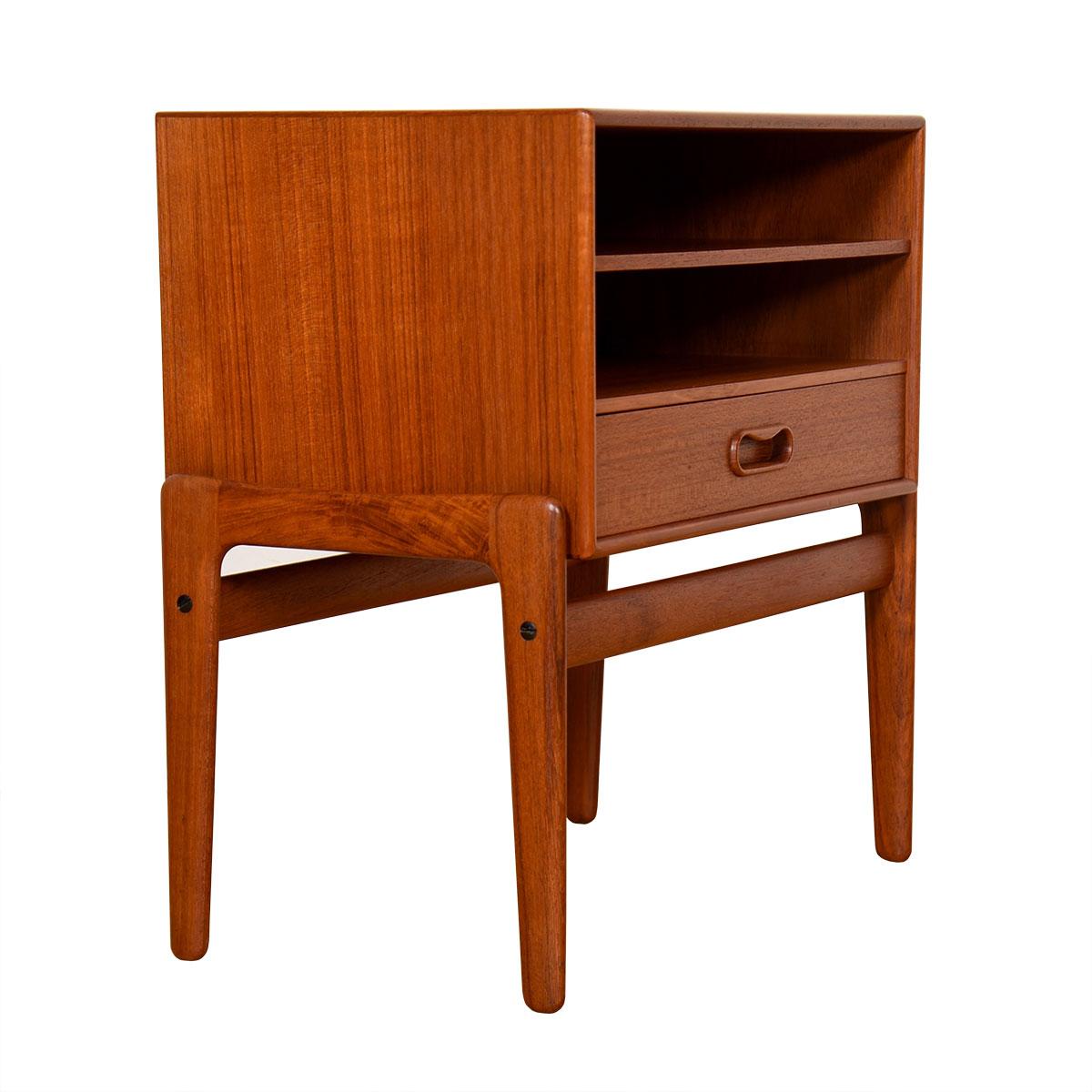 Exposed leg frame supports the case of the piece.
Features two shelves and a drawer — drawer is meant to fit in any of the slots / shelf cubbies. Drawer has sculptural oval pull.

