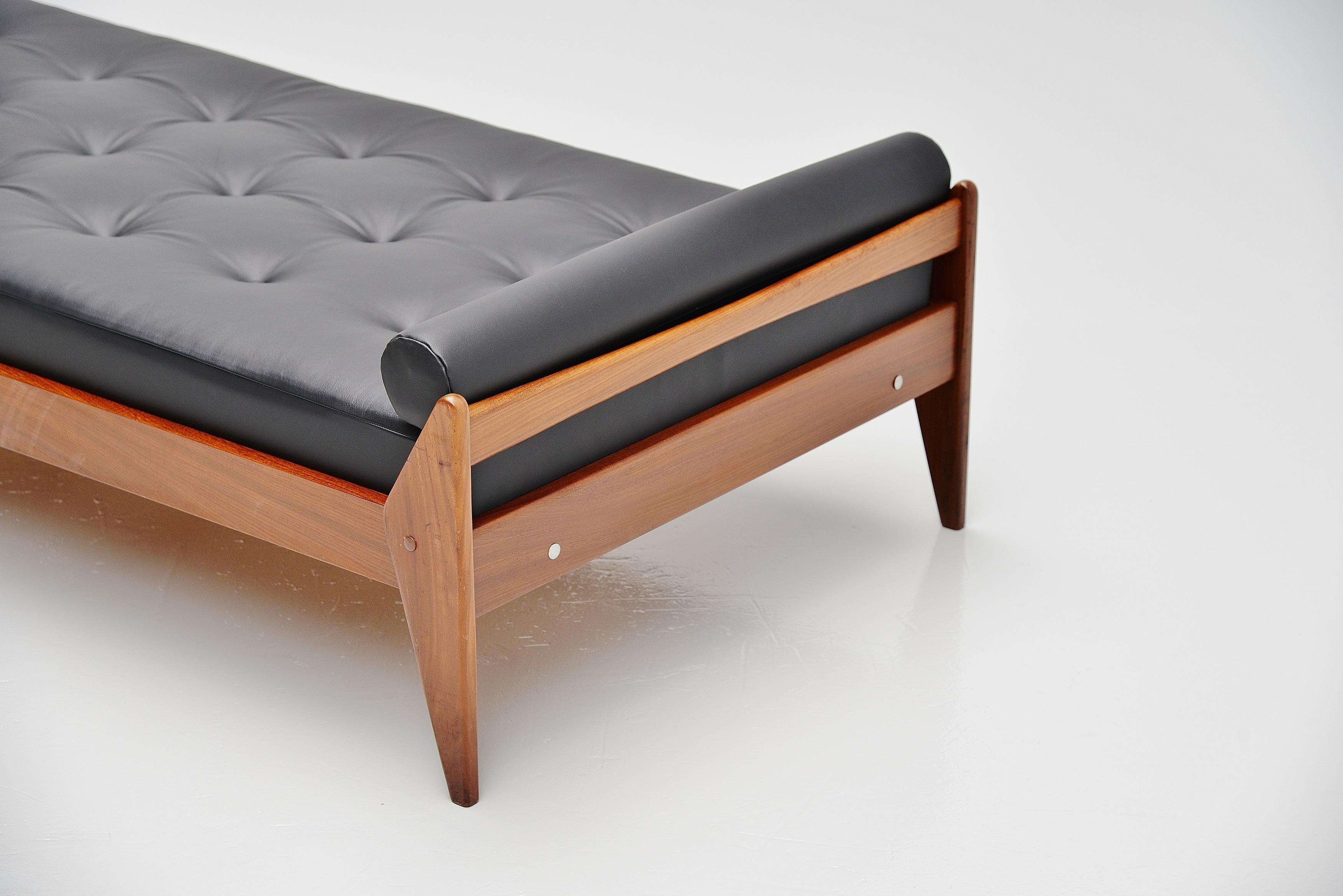 Very nicely Danish modern shaped teak daybed manufactured by Vamo Sonderborg, possible designed by Arne Wahl Iversen Denmark 1960. This bed is made of solid teak and we upholstered it with high quality smooth black leather from Hulshoff. This black