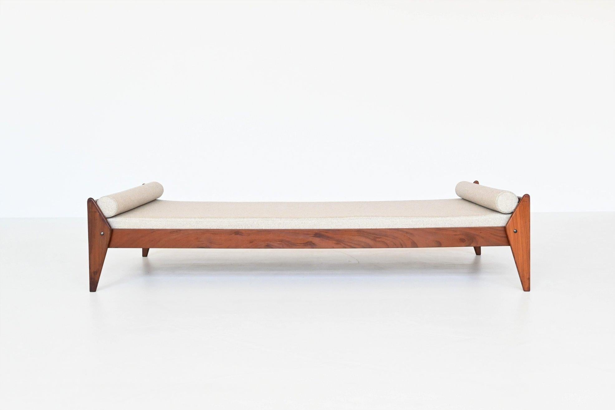 Beautiful shaped Danish daybed manufactured by Vamo Sonderborg and possibly designed by Arne Wahl Iversen, Denmark 1960. This very nice daybed is made of solid teak and the mattress is upholstered with beige Richwool fabric. This light upholstery is