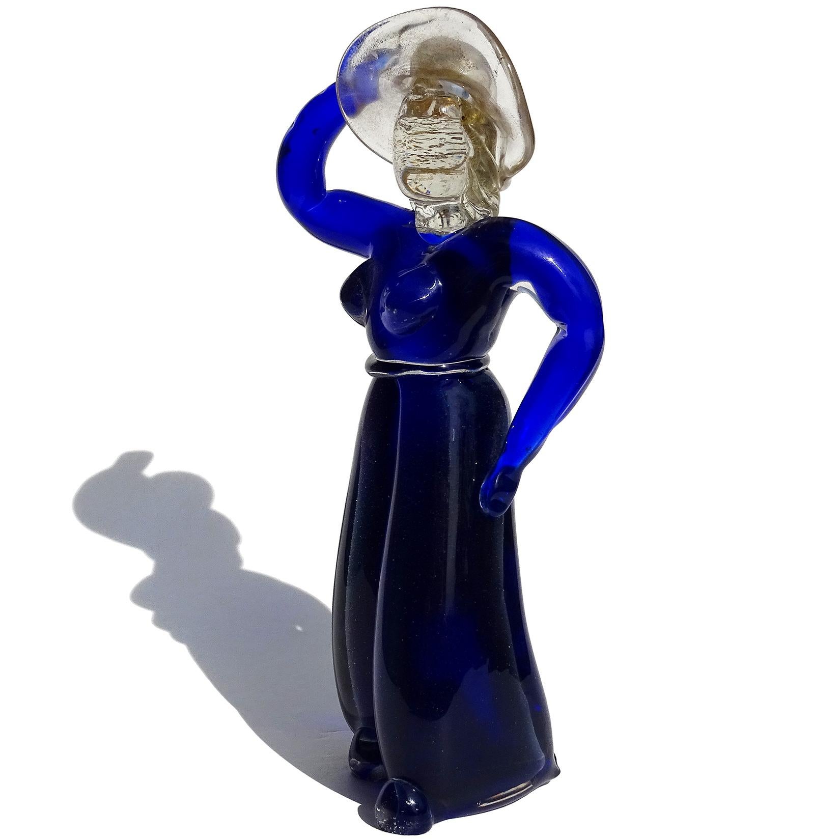 Beautiful early Murano hand blown Sommerso cobalt blue and gold flecks Italian art glass women with sun hat figure / sculpture. Documented to designer Alfredo Barbini, for V.A.M.S.A (Vetri Artistici Muranesi Societá Anonima) circa 1930s. The blue