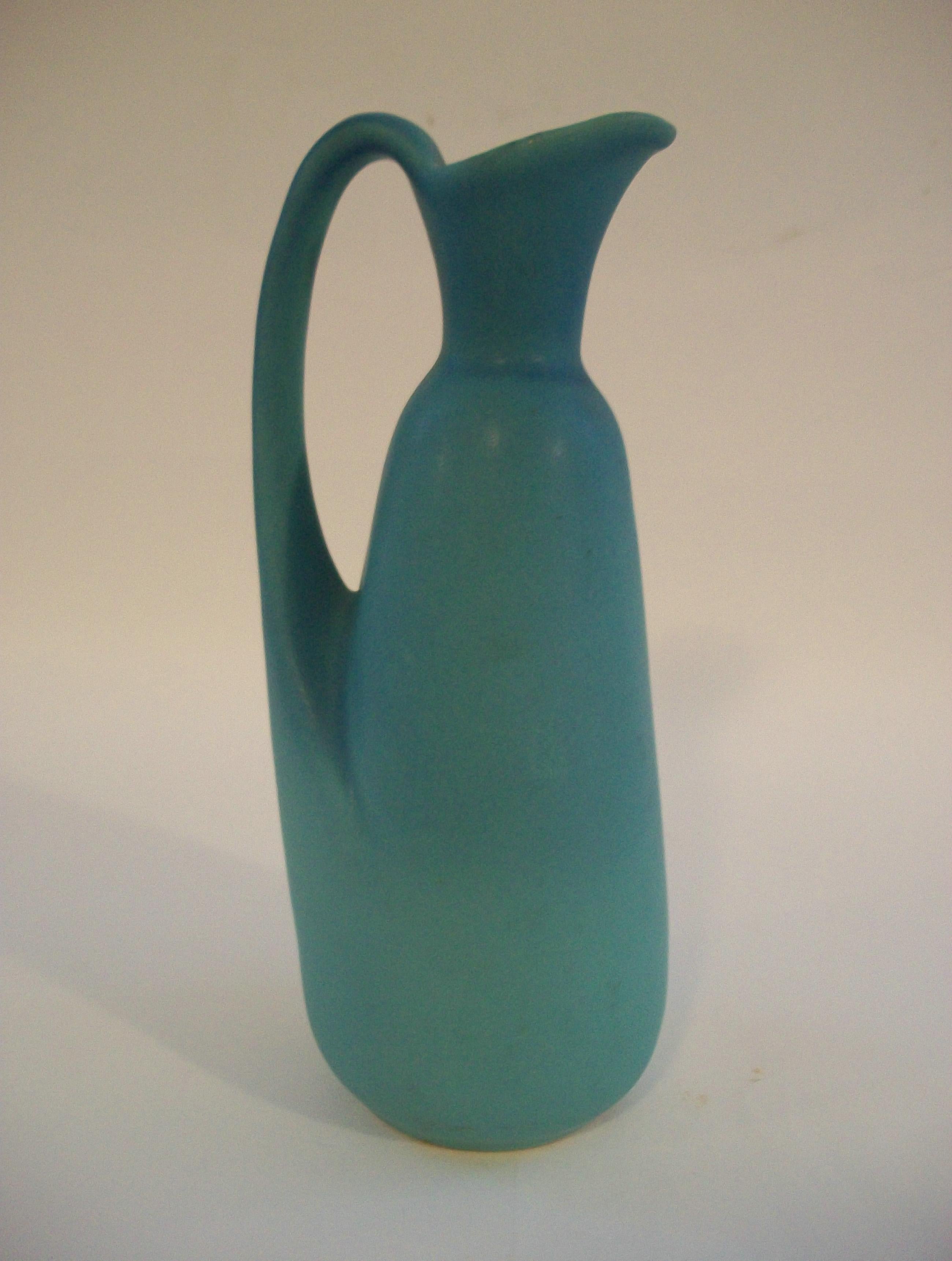 VAN BRIGGLE POTTERY - Arts & Crafts style ceramic pitcher or vase - featuring a Ming turquoise satin finish glaze - medium size with an applied organic handle - signed on the base VAN BRIGGLE COLO SPGS - United States (Colorado Springs, Colorado) -