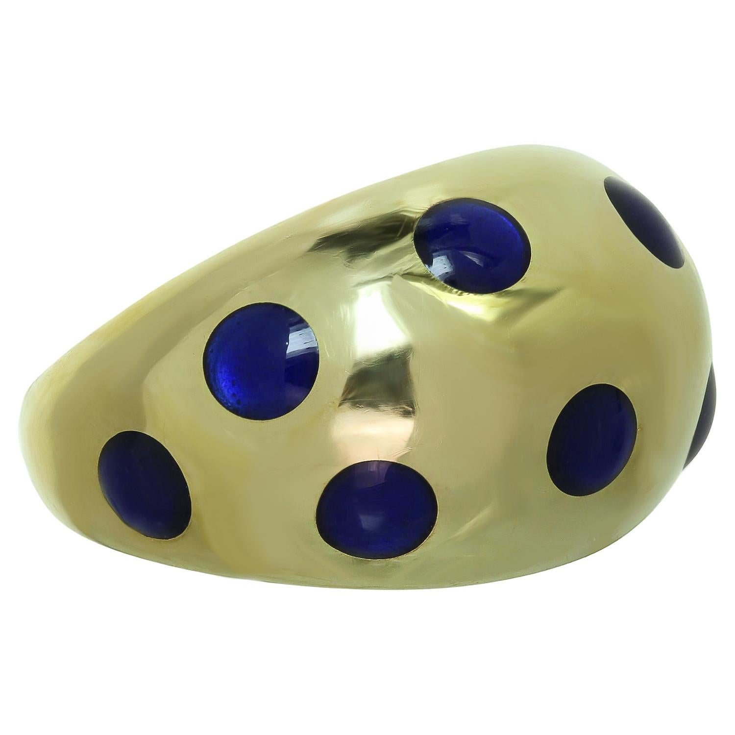 This fabulous Van Cleef & Arpels vintage ring features a domed band design crafted in 18 yellow gold and set with blue enamel dots. Made in France circa 1970s. Measurements: 0.47