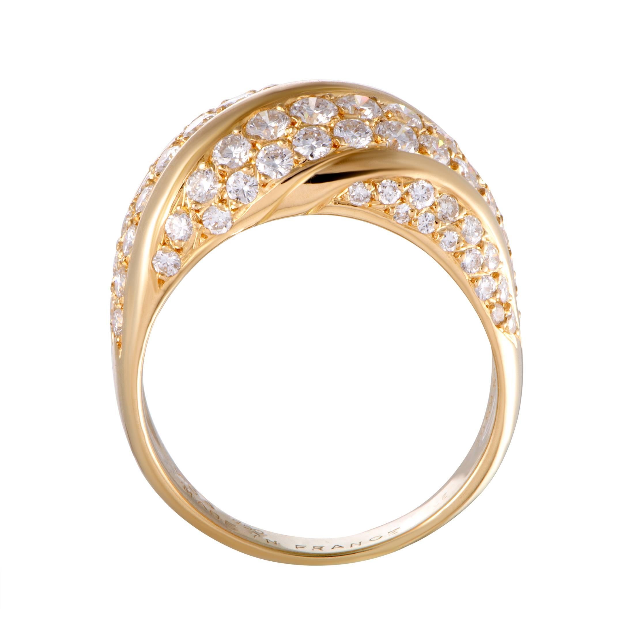 Van Cleef & Arpels achieved a fascinatingly luxurious appearance in this superb ring by combining the radiant 18K yellow gold with the ever-dazzling diamond stones. The ring boasts a total of 1.65 carats of colorless (grade F) diamonds of VVS