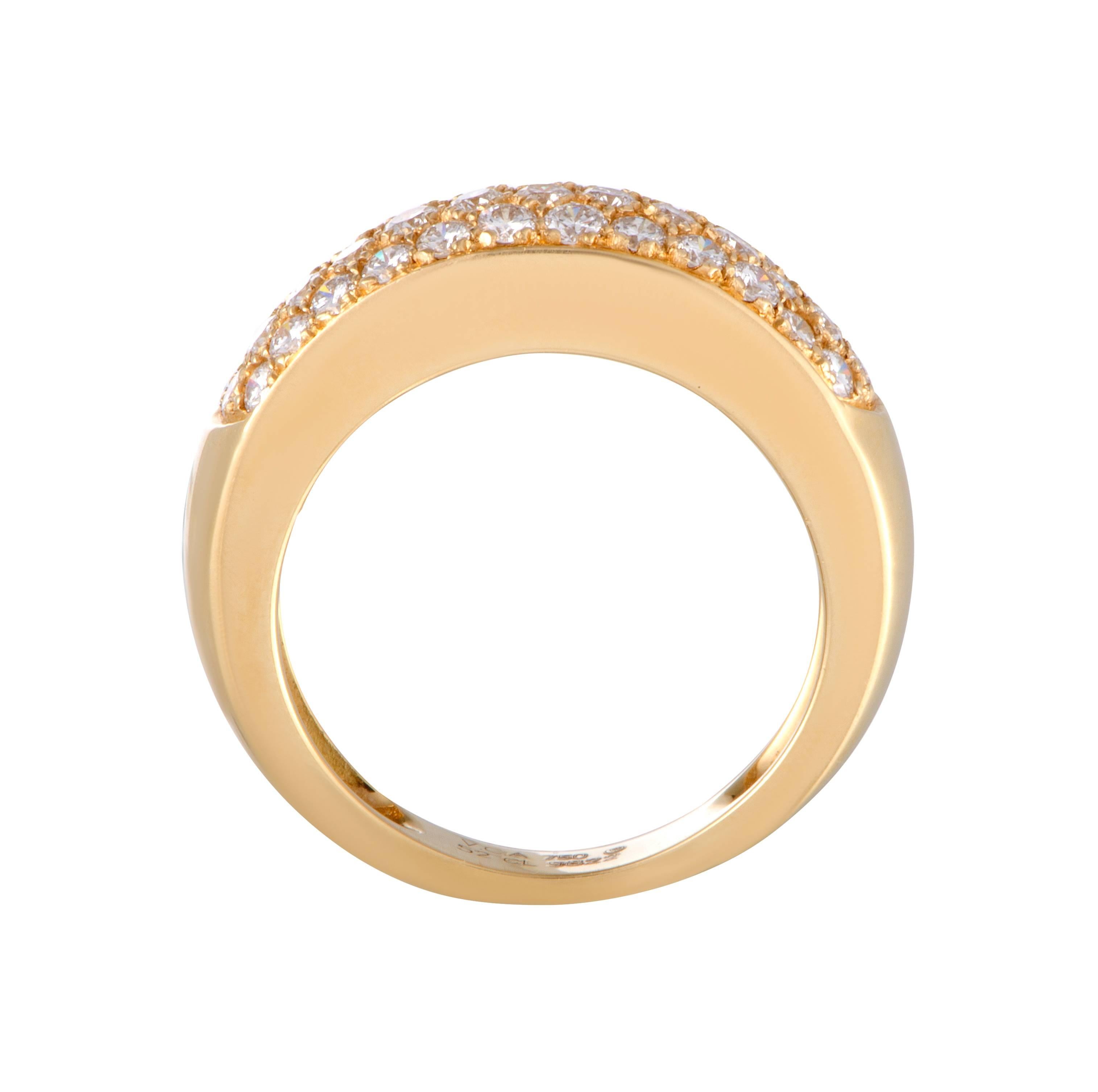 An endearingly subtle design and luxurious diamond décor are combined in this superb Van Cleef & Arpels ring into creating a piece of exceptional aesthetic value. The ring is made of classy 18K yellow gold and expertly set with scintillating