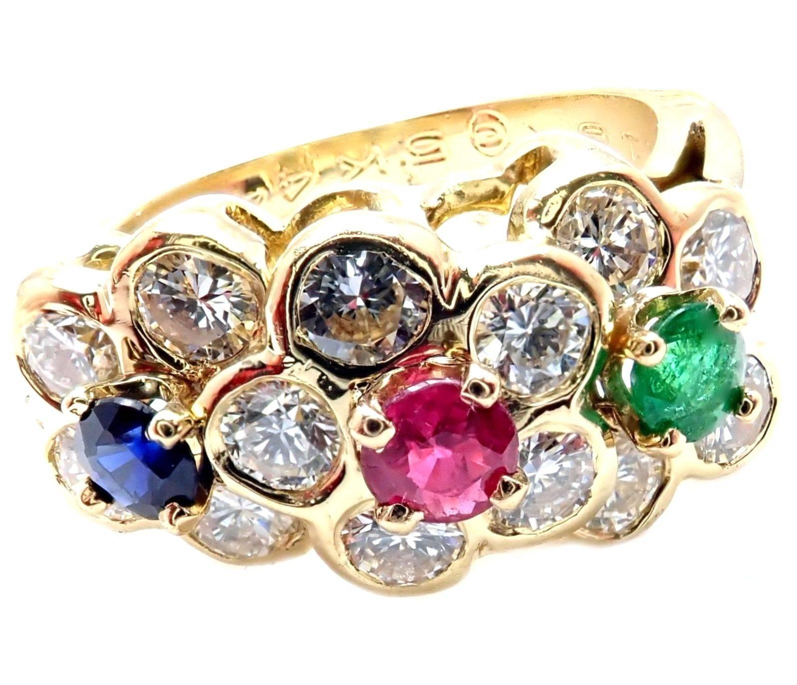 18k Yellow Gold Diamond Sapphire Ruby Emerald Flower Band Ring by Van Cleef & Arpels. 
With 13 diamonds, VS1 Clarity, G Color. Total Diamond Weight approx. 1.00ctw. 
One Ruby, Emerald, and Sapphire: 0.13ct each
Details:
Weight: 4.2 grams
Size: 4.5,