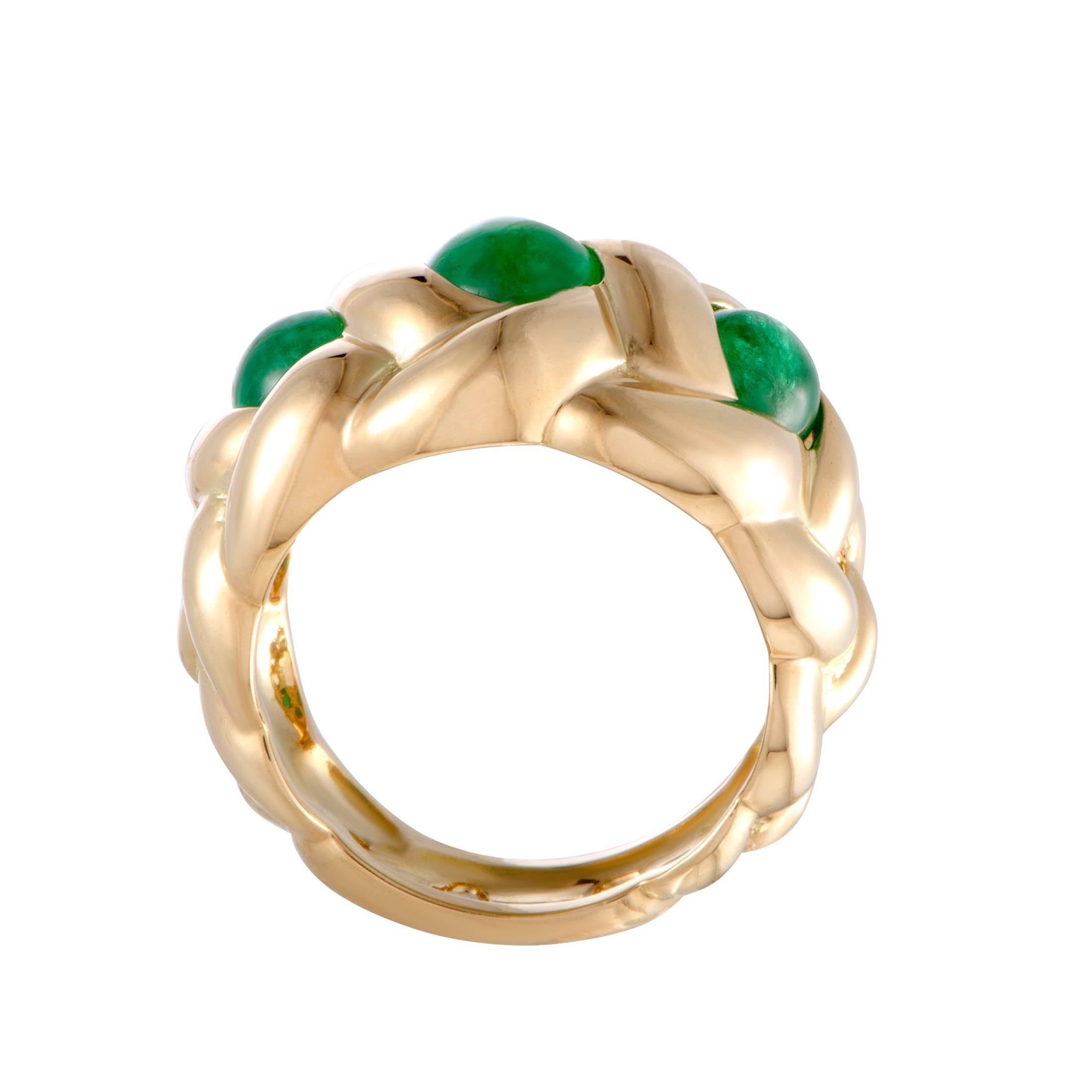 The endearingly radiant 18K yellow gold presents the perfect backdrop for the captivating emerald stones in this splendid ring that is designed by Van Cleef & Arpels. The emeralds weigh approximately 2.50 carats in total.
Ring Top Dimensions: 15mm x