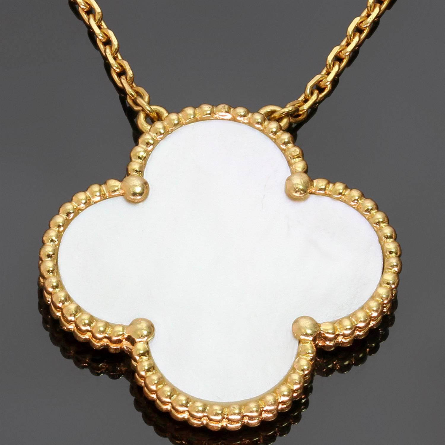 This elegant Van Cleef & Arpels necklace from the classic Magic Alhambra collection features a beaded lucky clover pendant crafted in 18k yellow gold and set with white mother-of-pearl. Made in France circa 2000s. Measurements: 1.02
