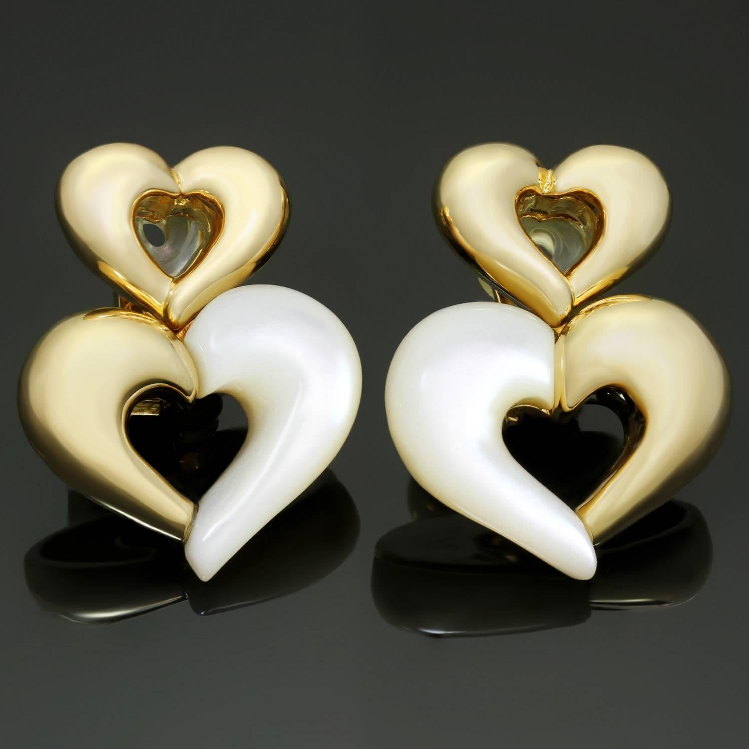These stunning Van Cleef & Arpels clip-on earrings feature a chic heart-shaped design crafted in 18k yellow gold and mother-of-pearl. Made in France circa 1990s. Measurements: 0.86