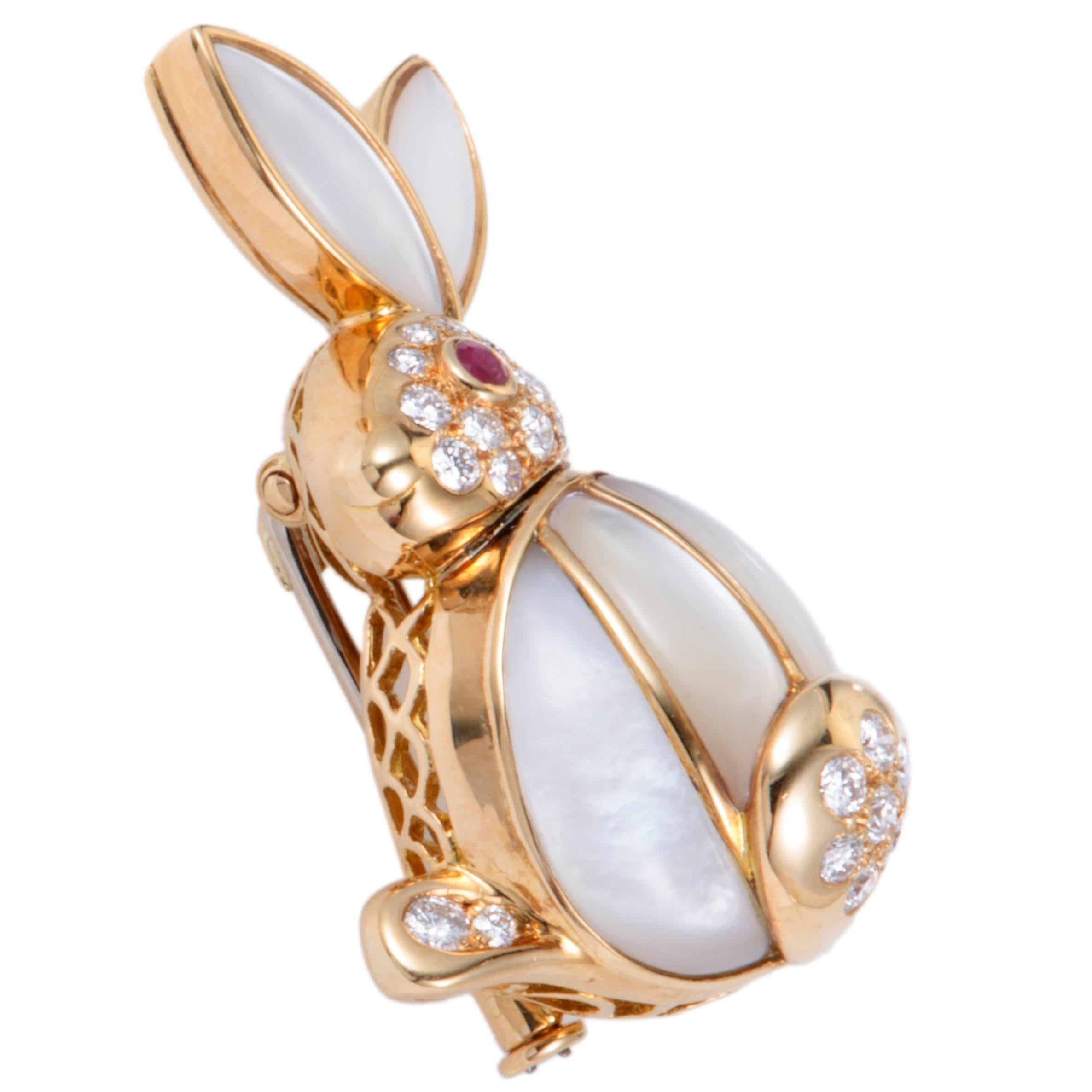 This remarkable brooch is one of Van Cleef & Arpels' brilliant designs. Its adorable rabbit-shaped design is crafted in shimmering 18K yellow gold, filled with the spectacular mother-of-pearl and embellished in 0.50ct of sparkling diamonds and a