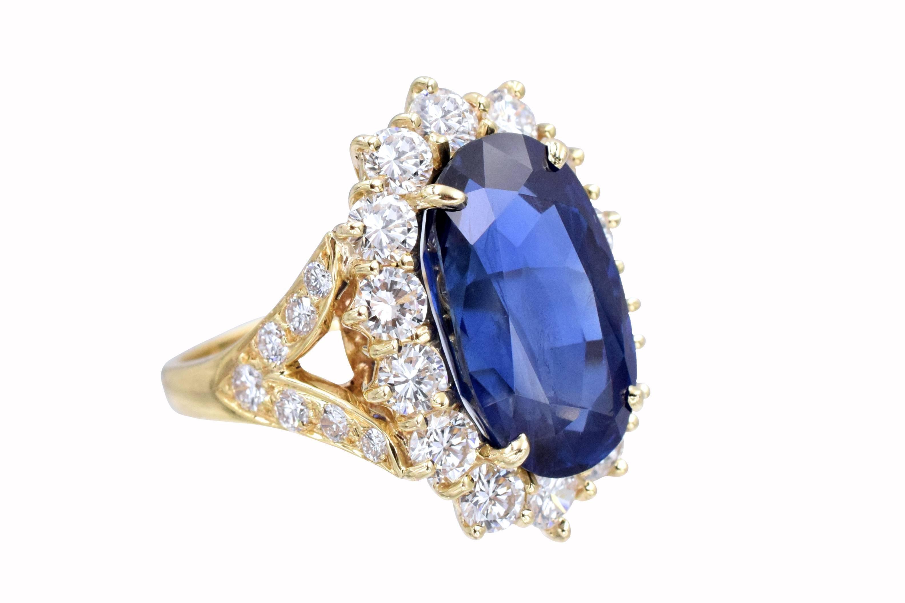 Van Cleef and Arpels Burmese sapphire and diamond ring.

Set with natural no enhancement oval old cut Burmese 12.01 carat sapphire, surrounded by 14 fine quality  brilliant shape diamonds. Sides are V shaped leaves with 7 encrusted diamonds each