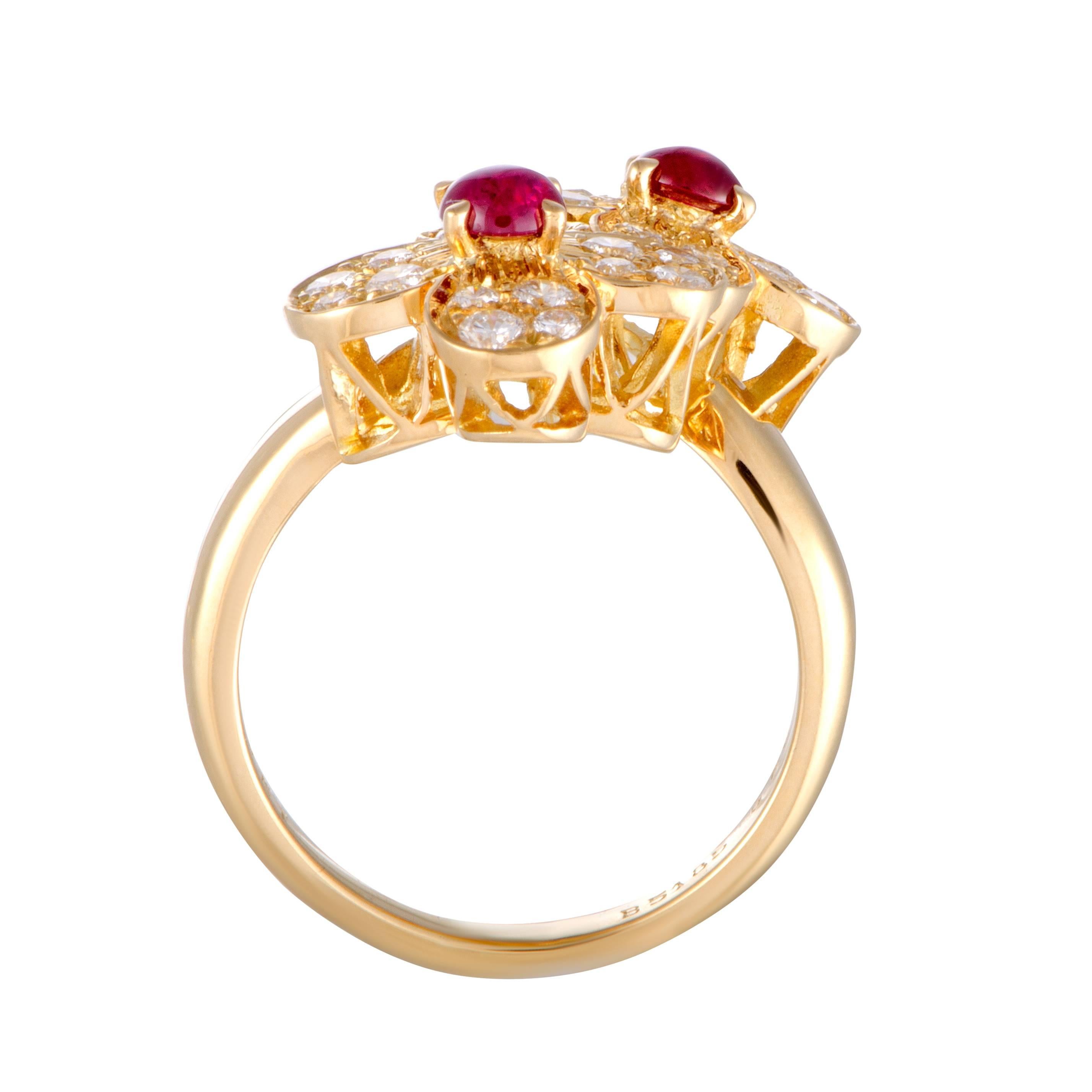 Depicting graceful flowers in an endearingly luxurious manner, this sublime Van Cleef & Arpels ring boasts a delightfully feminine appeal. The ring is made of 18K yellow gold and set with striking rubies accompanied by colorless (grade F) diamonds