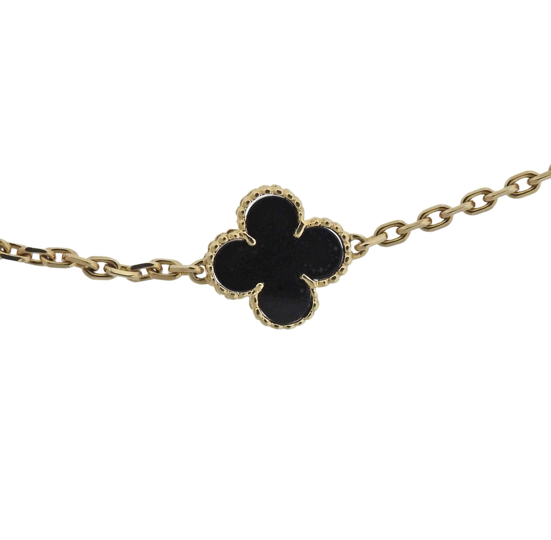 Iconic 18k yellow gold Alhambra necklace, set with twenty clover onyx elements, crafted by Van Cleef & Arpels. Retail $15500. Necklace is 32.5