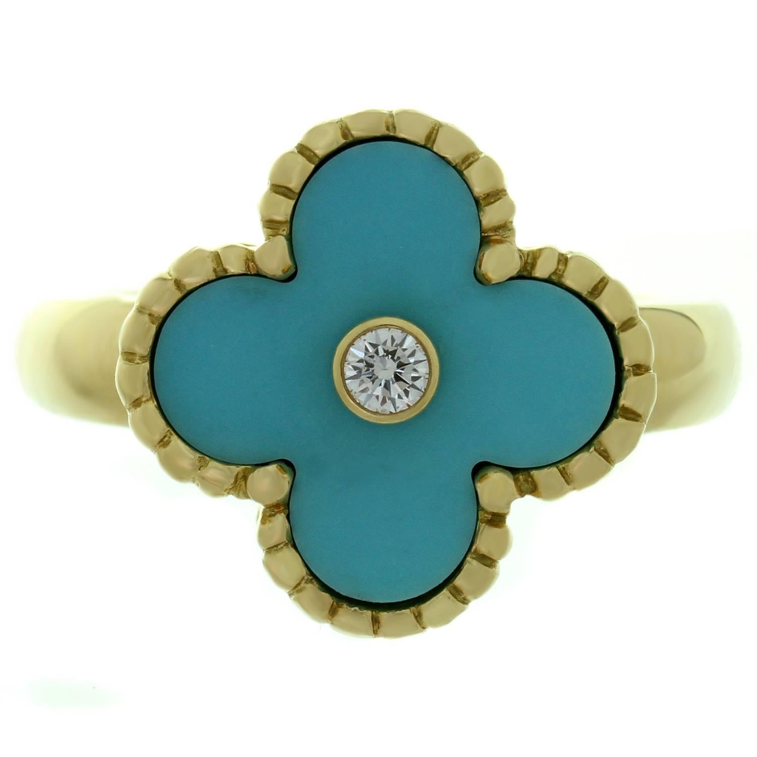 This fabulous Van Cleef & Arpels ring from the iconic Vintage Alhambra collection features the lucky clover design crafted in 18k yellow gold and beautifully accented with blue turquoise and a bezel-set brilliant-cut round diamond of an estimated