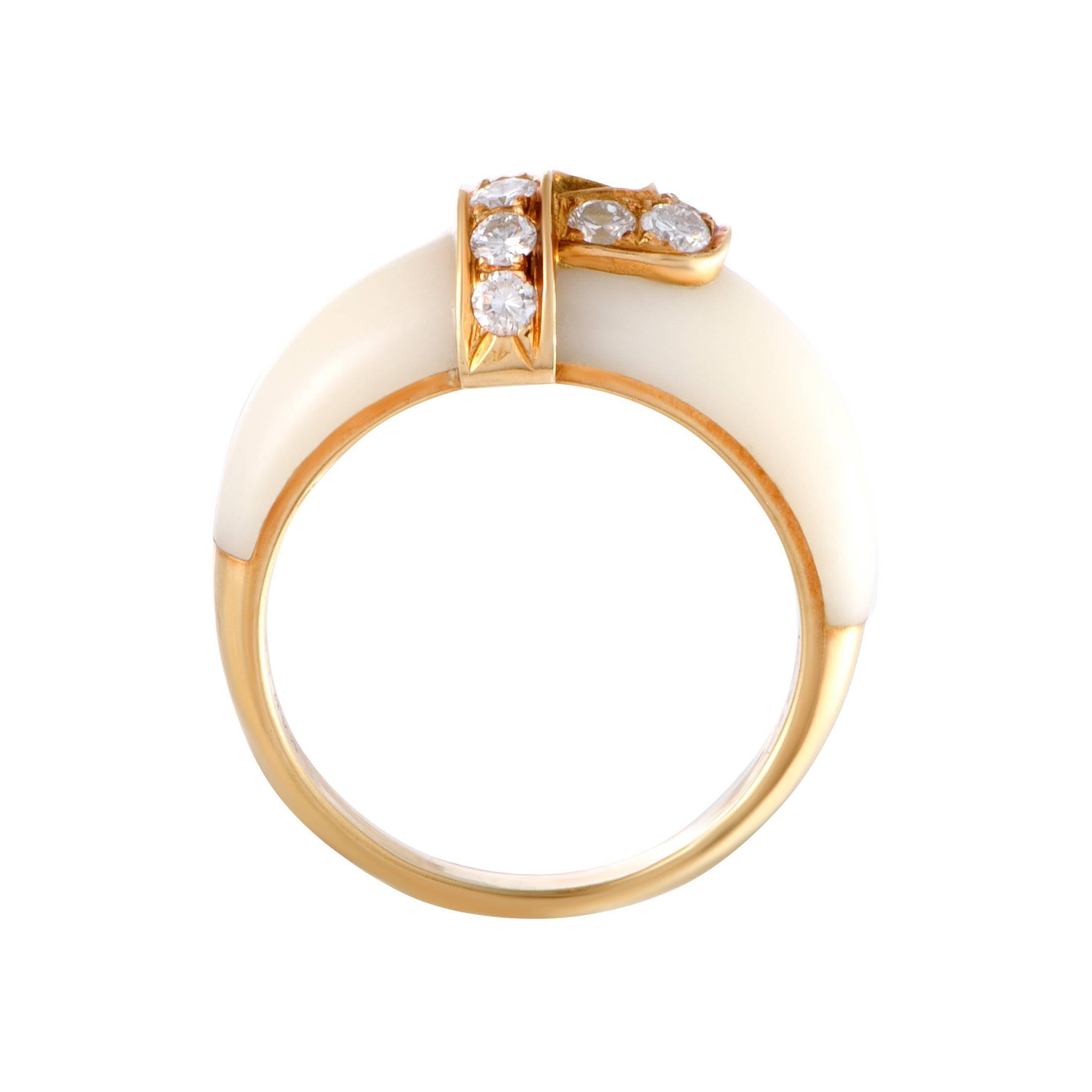 Creating a delightfully harmonious aesthetic effect, the radiant 18K yellow gold and the sublime white coral are featured in this splendid ring in the most stylish manner. The ring is a Van Cleef & Arpels design and also boasts scintillating diamond