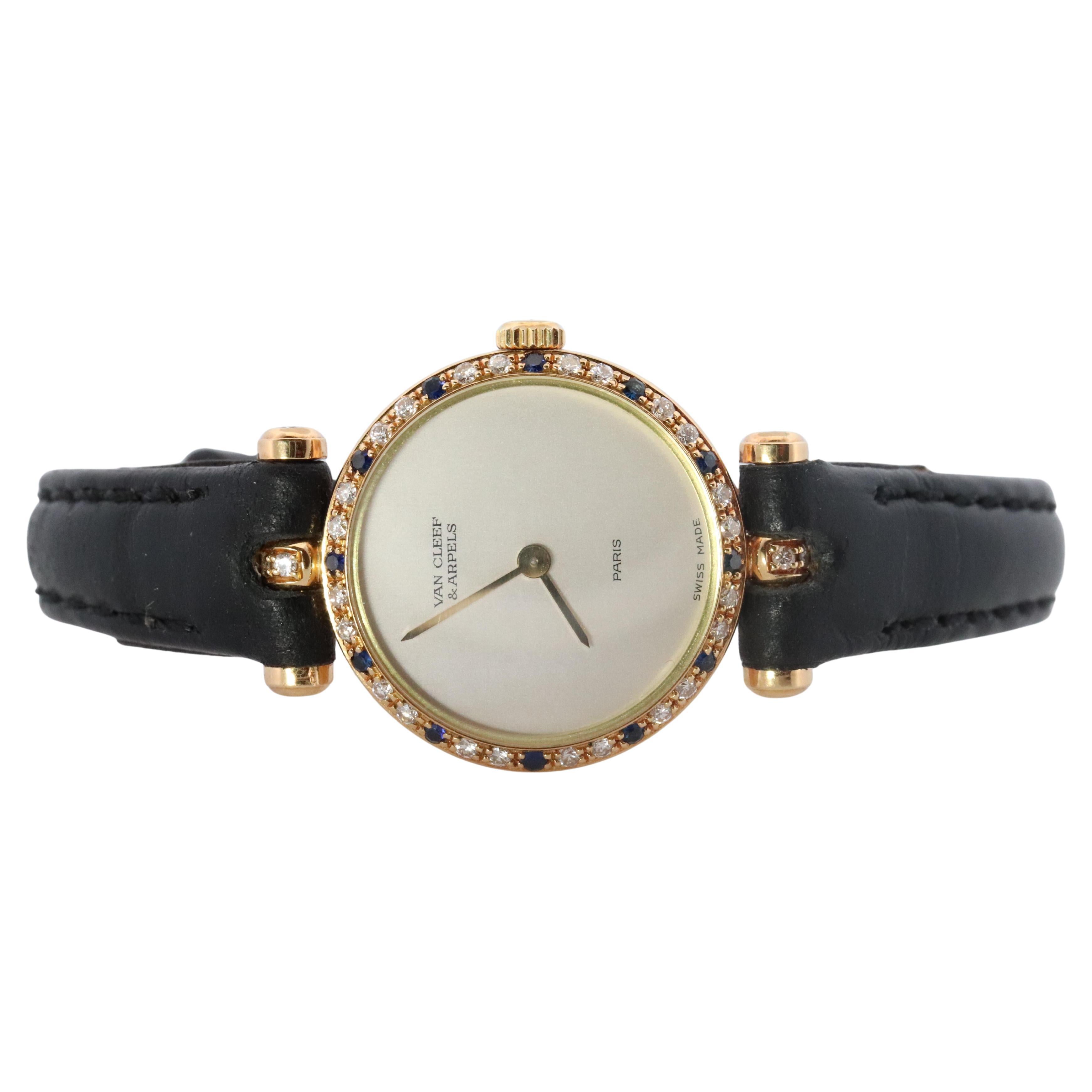 Montre Van Cleef & Arpels 18901. Lunette en or 18k VCA Classique Diamant Saphir.