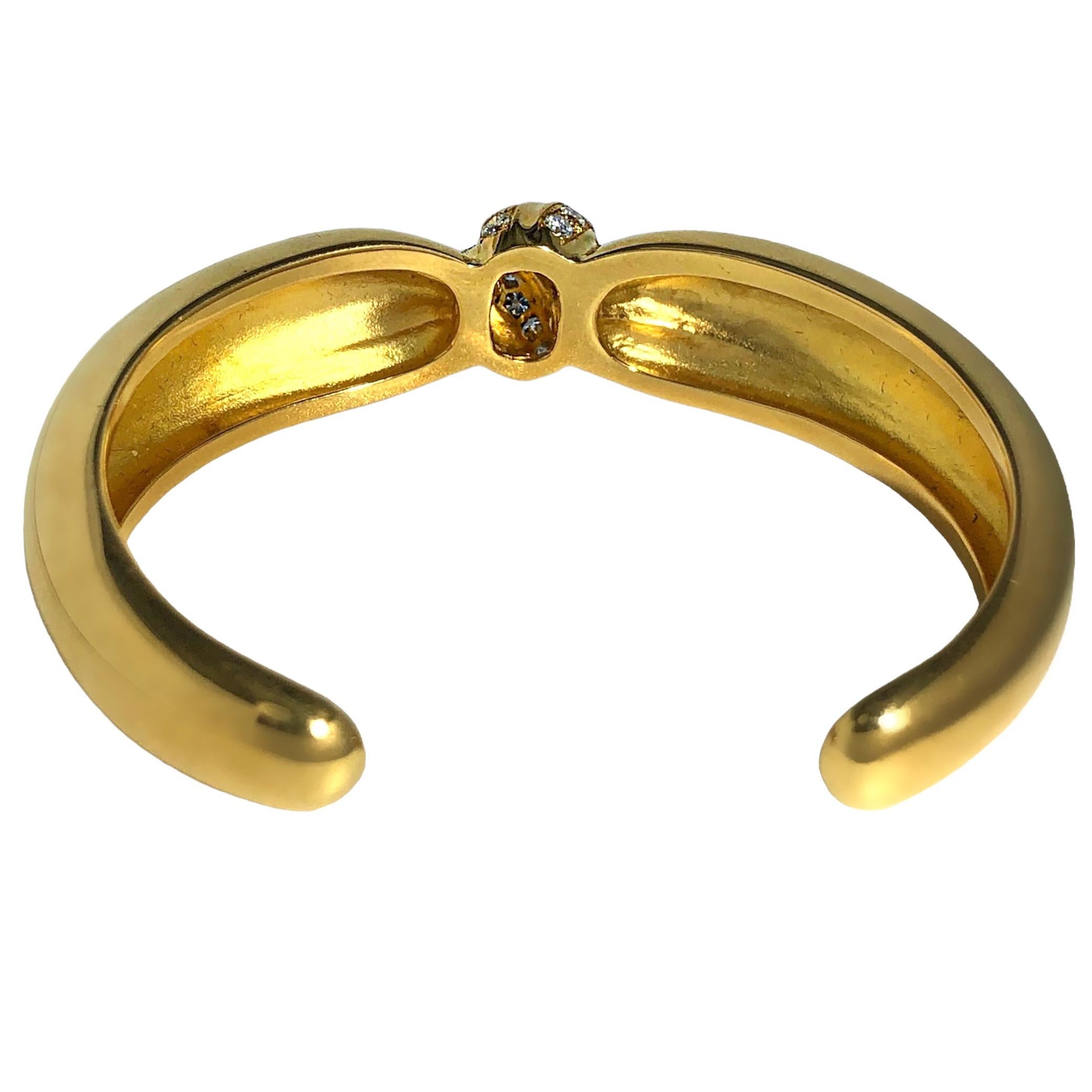 Taille brillant Van Cleef and Arpels, bracelet jonc torsadé en or jaune 18 carats et diamants