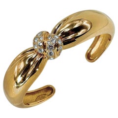 Van Cleef and Arpels, bracelet jonc torsadé en or jaune 18 carats et diamants