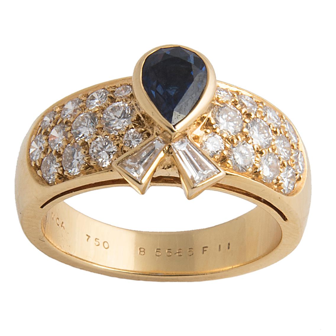Elegant ring by Van Cleef & Arpels, pavé set diamonds centered by a pear-shaped blue sapphire and two tapered baguette diamonds representing a bow
Signed VCA, maker's mark, French hallmarks and numbered  B5585 F11
Size EU: 53, US 6 1/4
Ca 2000