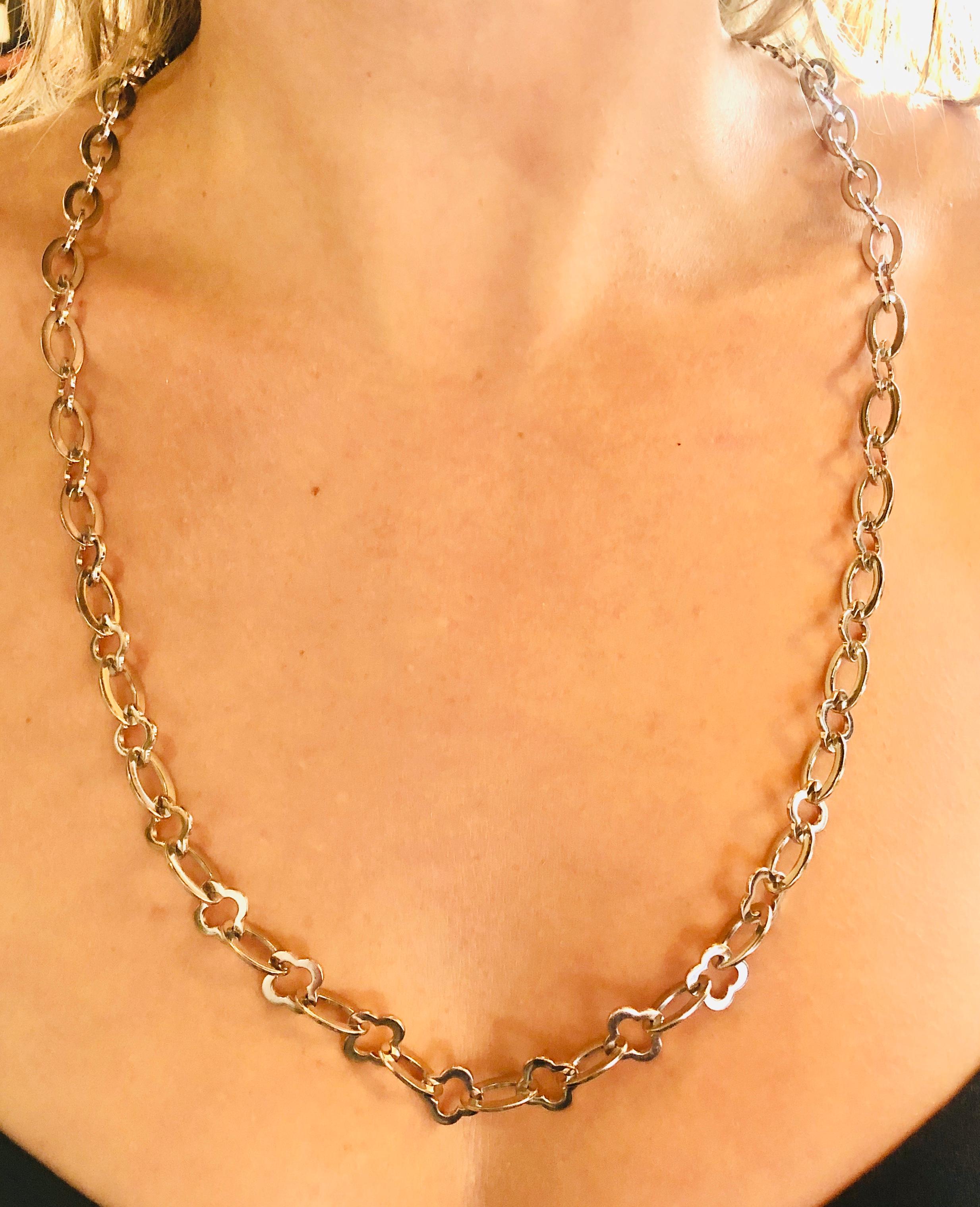 Van Cleef and Arpels Discontinued Byzantine Alhambra Articulated Chain in White Gold. 32 inch long chain. The weight of the chain is 103 grams. Serial number BL 30349 bears French maker's mark. This chain is in very good condition. 


