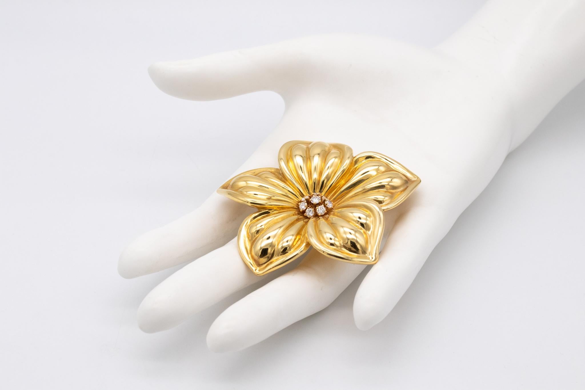Beautiful brooch designed by Van Cleef & Arpels. 

Very chic Rose de Noel flower brooch with diamonds. Crafted in France in solid yellow gold of 18 karats and finished with very high polish. Is suited at the reverse, with a hinged pin bar and a