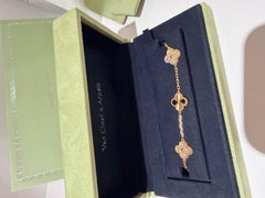 Van Cleef and Arpels 5 motif bracelet in guilloche gold and diamonds