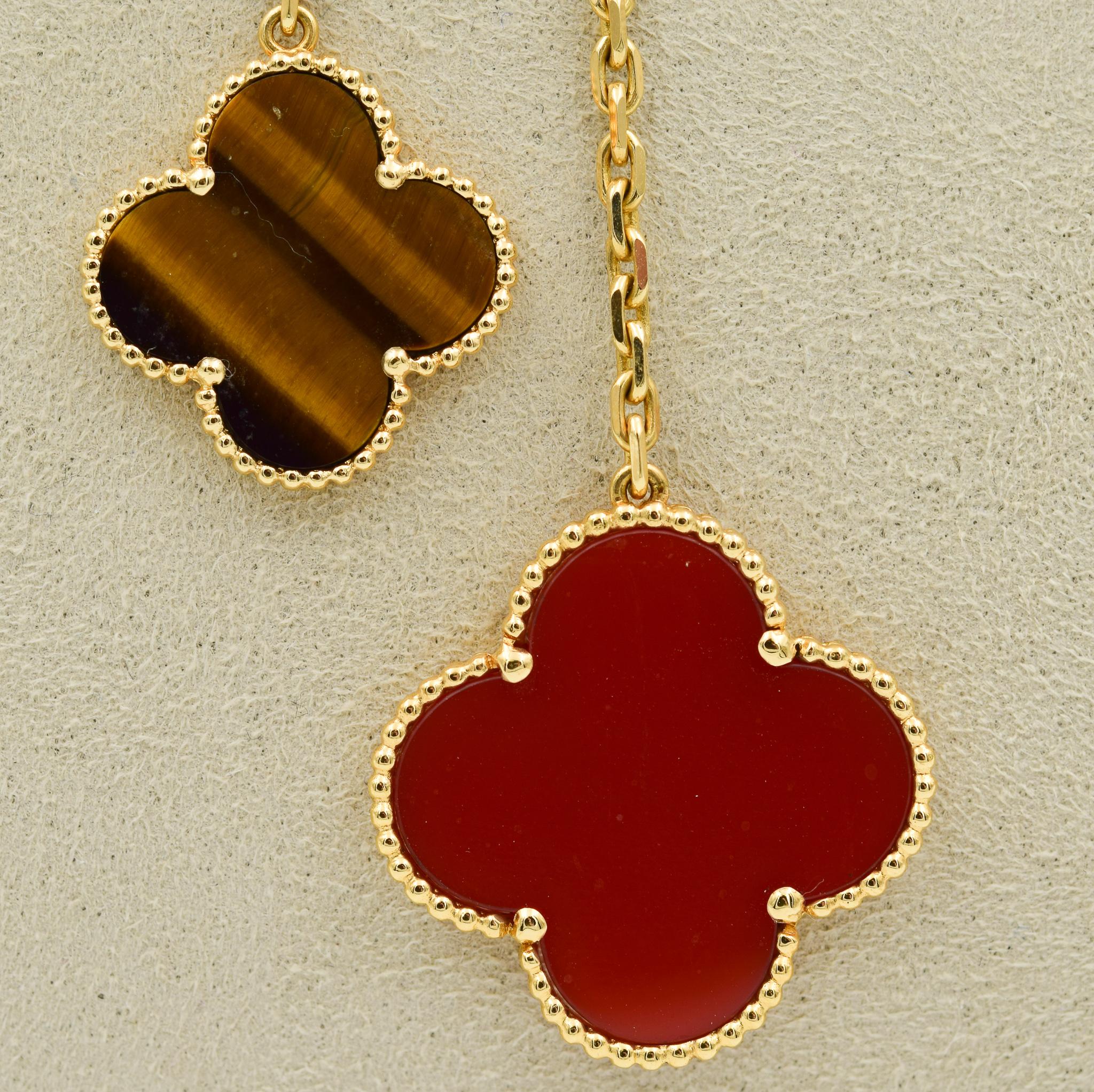 This beautiful Van Cleef & Arpels necklace was recently traded in to our store and is in very good condition.  This Alhambra necklace features alternating Carnelian and Tigers Eye Motifs.  The chain is in 18k yellow gold and 16