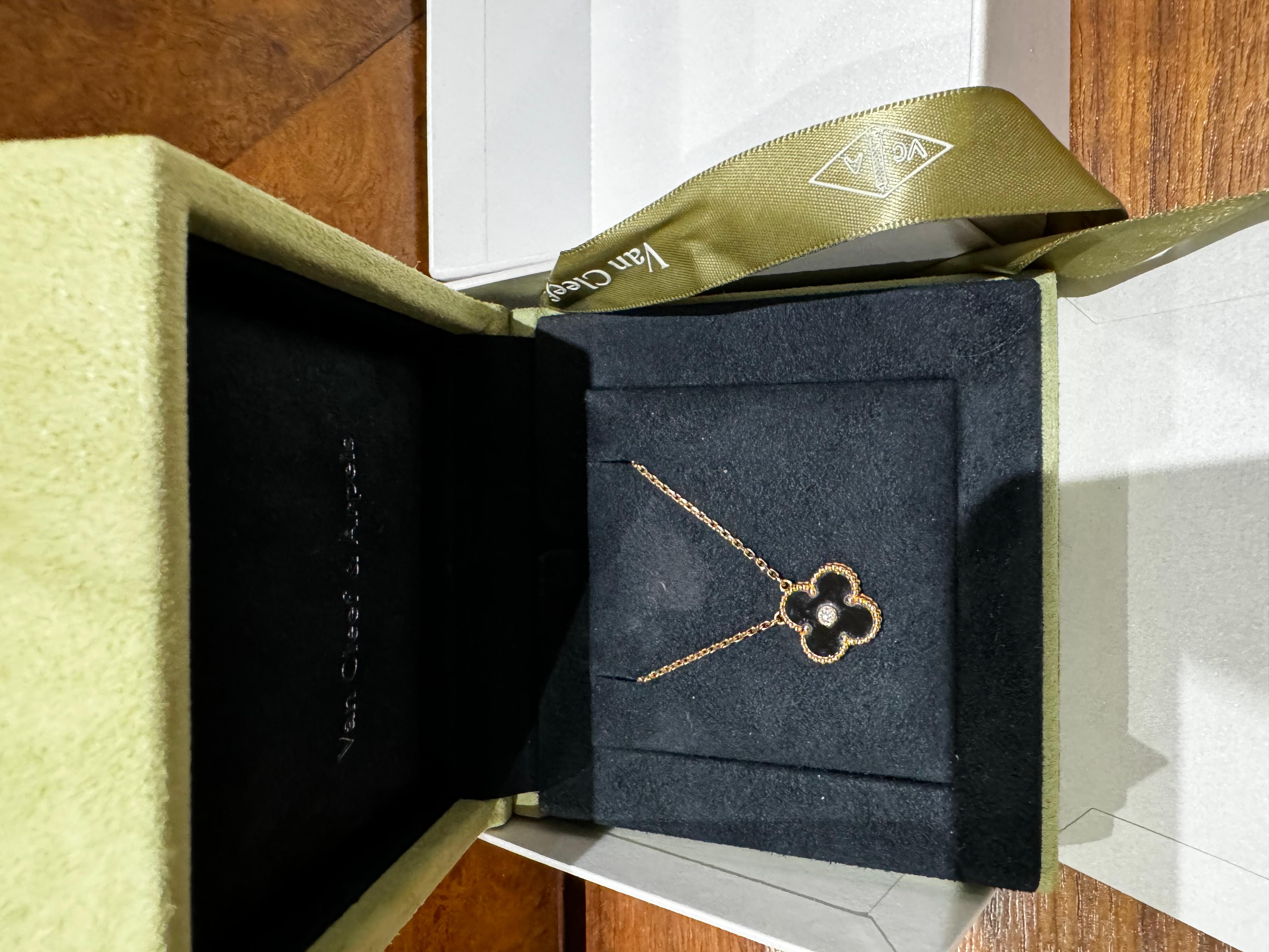 Van Cleef and Arpels Alhambra 2016 Holiday Diamond Onyx Pendant Necklace. Comes with original box and packaging.  VCA holiday pendants are collectible and onyx is one of the most resistant and sought after ones. 