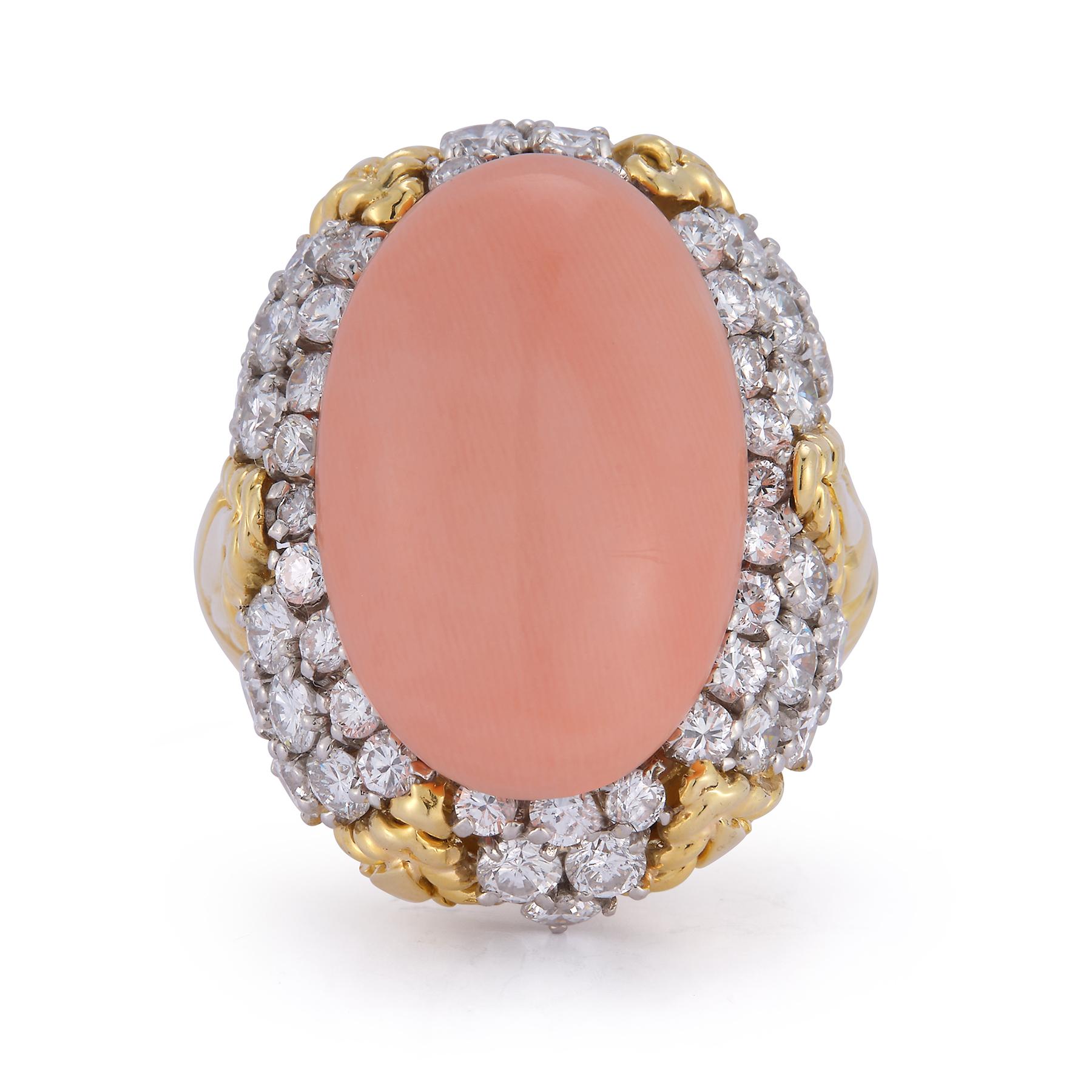 Van Cleef and Arpels Angel Skin Coral and Diamond Cocktail Ring. 

1 Cabochon angel skin coral with round cut side diamonds set in 18k yellow gold.

Ring Size: 6.5

Signed, Van Cleef & Arpels & numbered 
