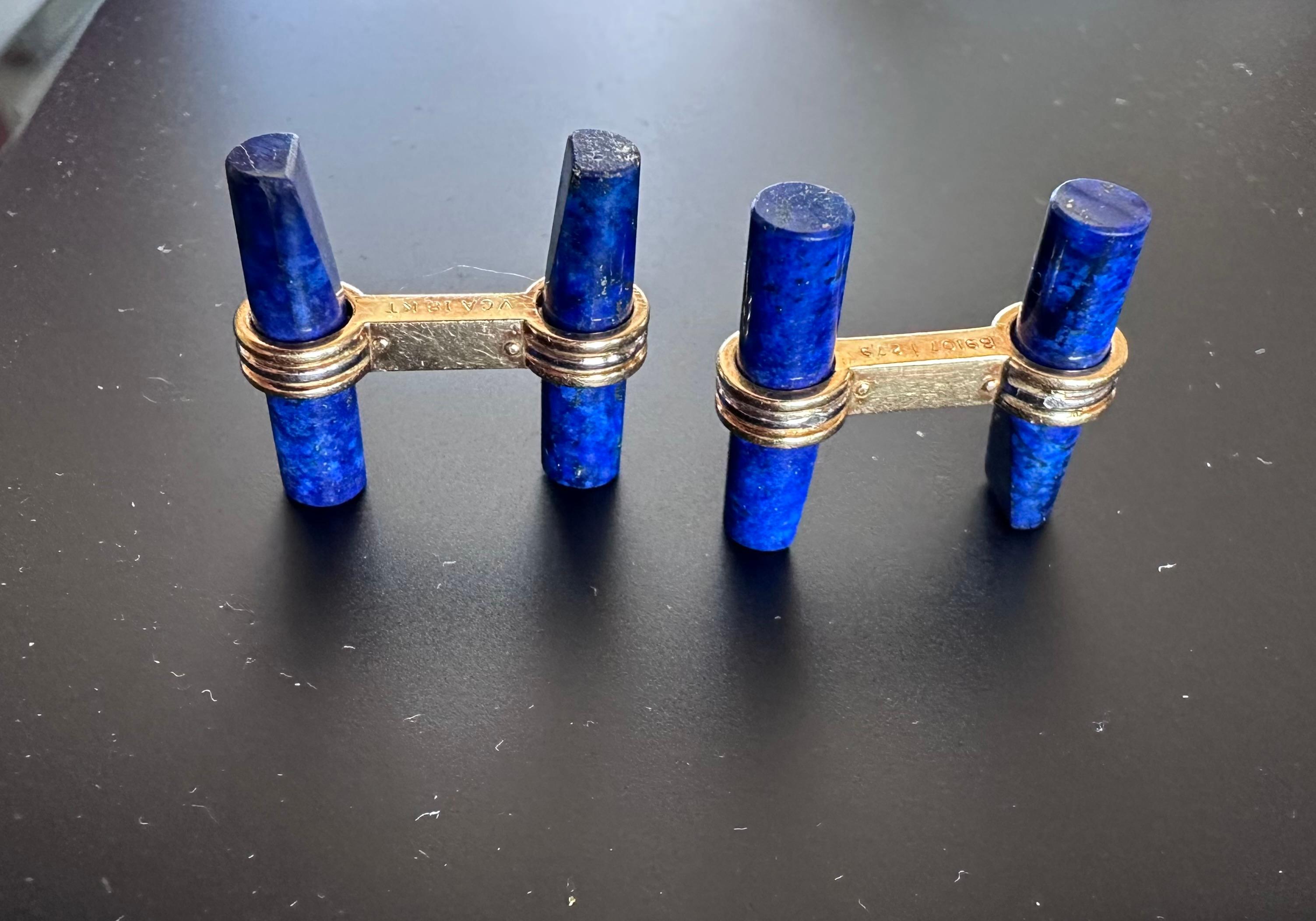 Van Cleef & Arpels Cufflinks
18k Yellow Gold
4 polished Lapis Lazuli cylinder separated by a gold post. Easily removable post and easily threaded through the shirt cuff.
11 Grams
1 inch by .75 inches
Hallmarks and Numbers
