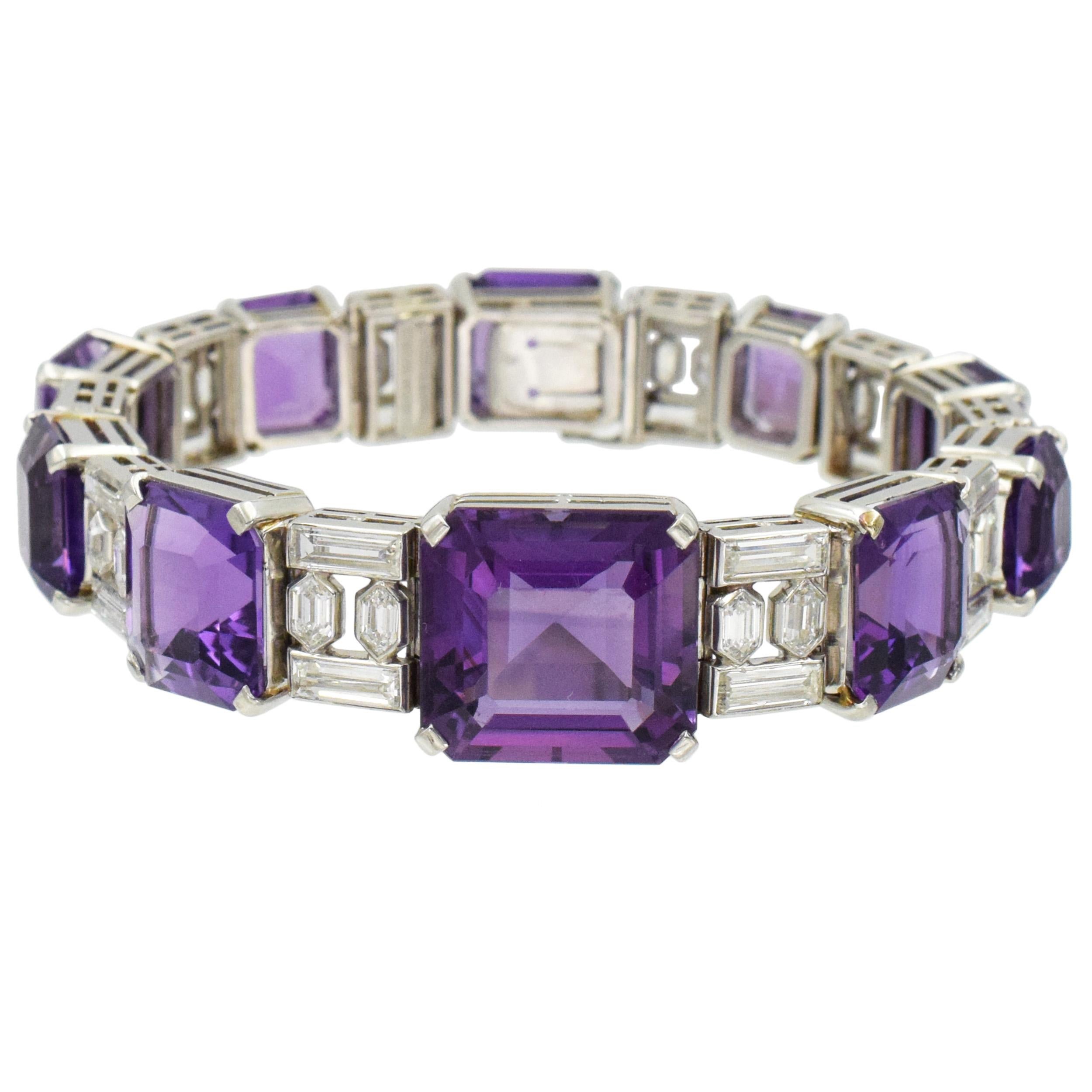Van Cleef And Arpels diamond and amethyst line bracelet in platinum. 
The bracelet features 10 emerald cut amethysts graduating in size, alternating with 10 links consisting of 2 baguette and 2 hexagonal cut diamonds each. There is total of 20