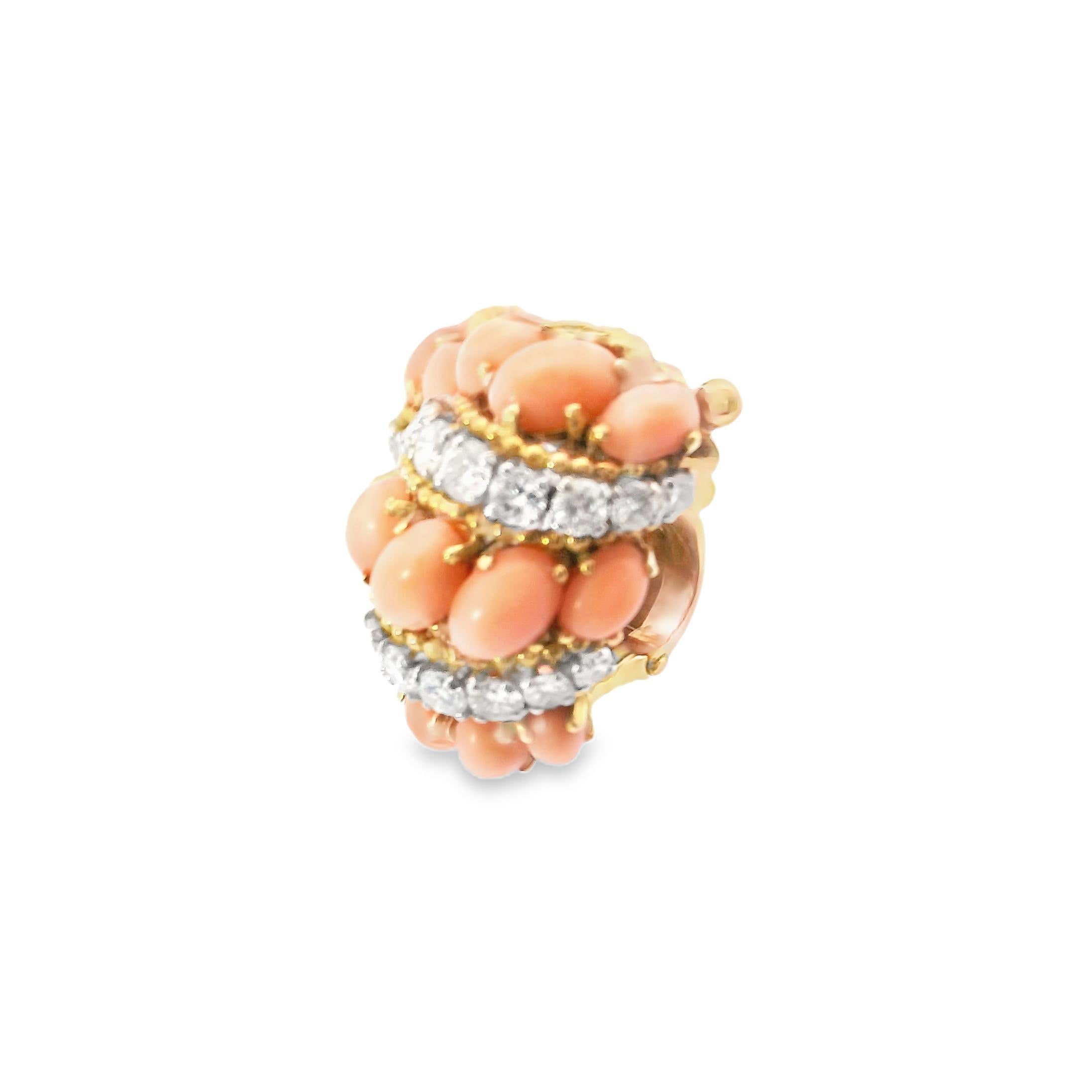 These extraordinary clip-on earrings by Van Cleef & Arpels exemplify the brand’s signature blend of elegance and bold design. Crafted in 18k yellow gold, the earrings feature vibrant orange coral beads that radiate warmth and vitality. Intertwined