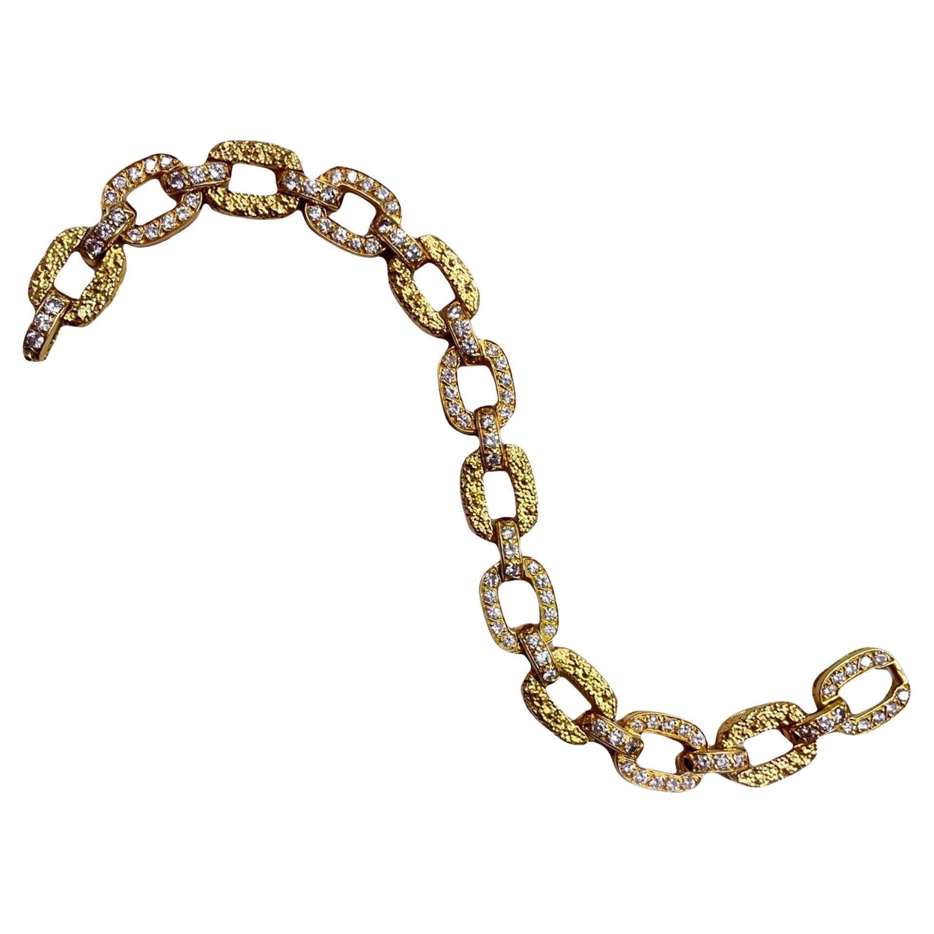 Van Cleef and Arpels Diamond 18k Gold Bracelet, ca. 1940s

A very chic and well wearable diamond and gold link bracelet made by Van Cleef & Arpels. The bracelet alternates with diamond links (ca. 7 carats) and 18k textured gold links. The gold work