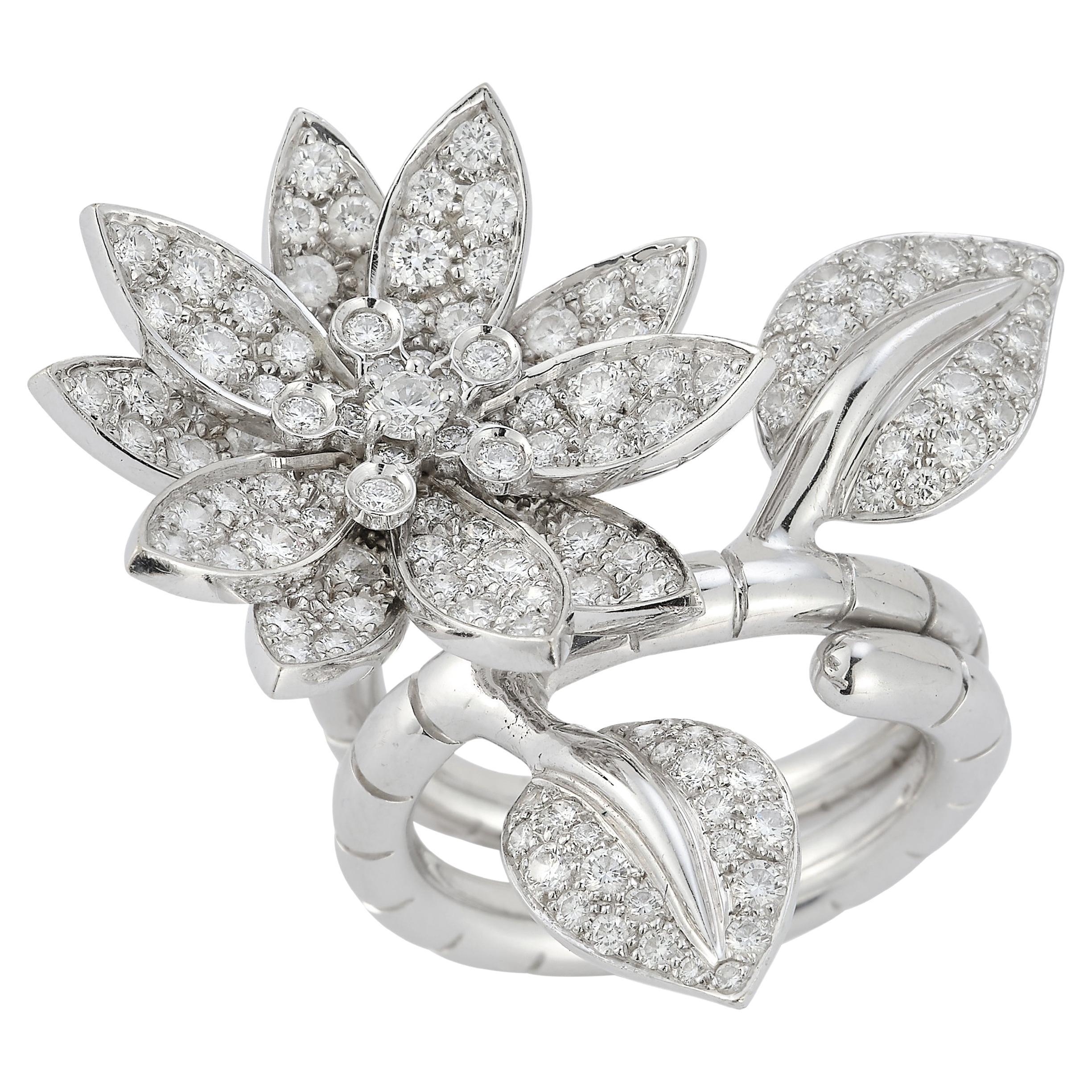 Van Cleef and Arpels Diamond Lotus Between The Finger Ring 

An 18k white gold ring in the design of a lotus flower set with 127 round diamonds with a total weight of 2.14ct. 

Transforms into a between the finger ring.

Listed on Van Cleef & Arpels
