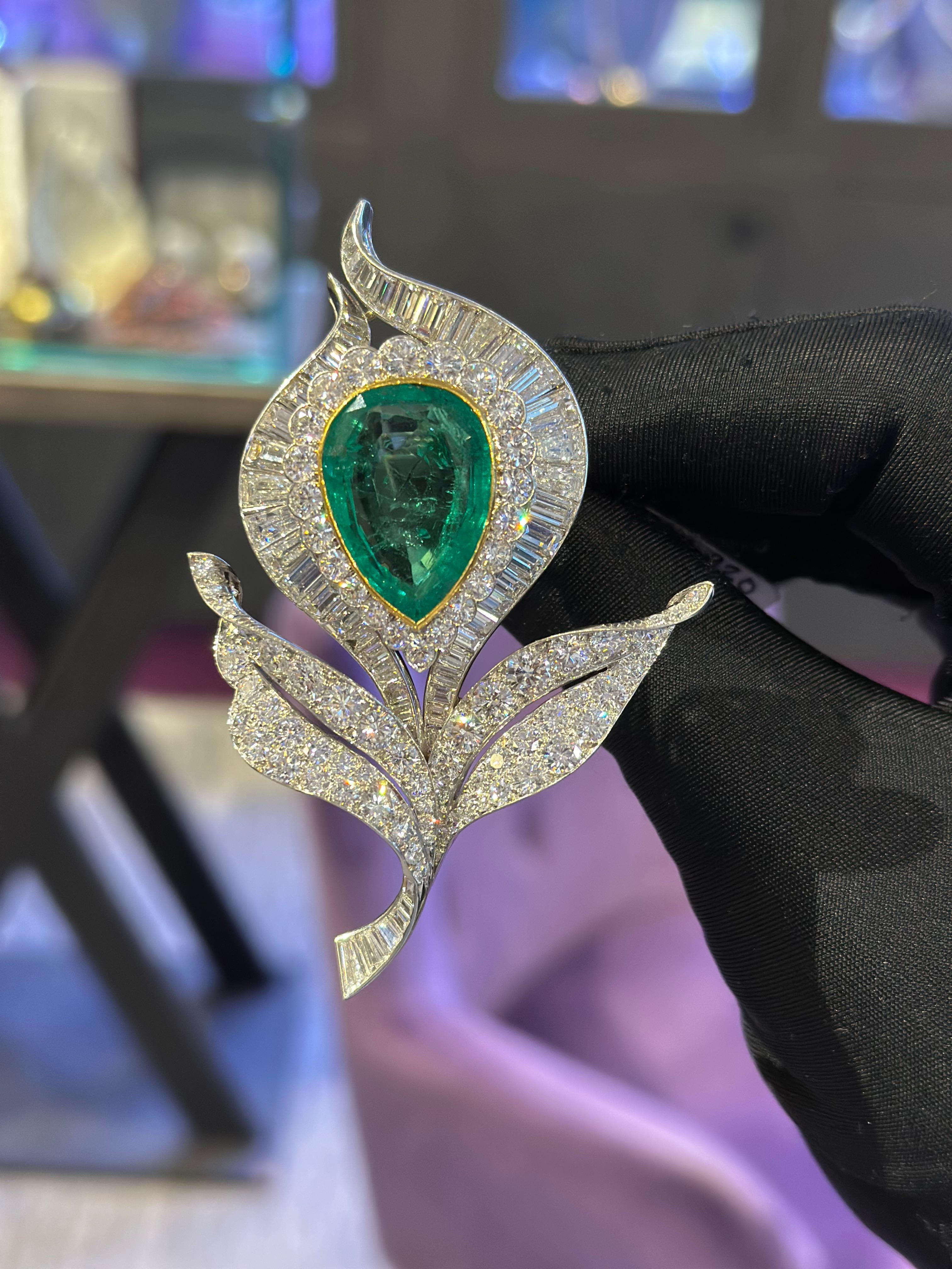 Van Cleef and Arpels Emerald and Diamond Floral Brooch

A brooch featuring round and baguette diamonds and a large pear-shaped emerald.

Accompanied by a AGL report stating that the emerald is of Colombian origin. 

Approximate Emerald Weight: 18