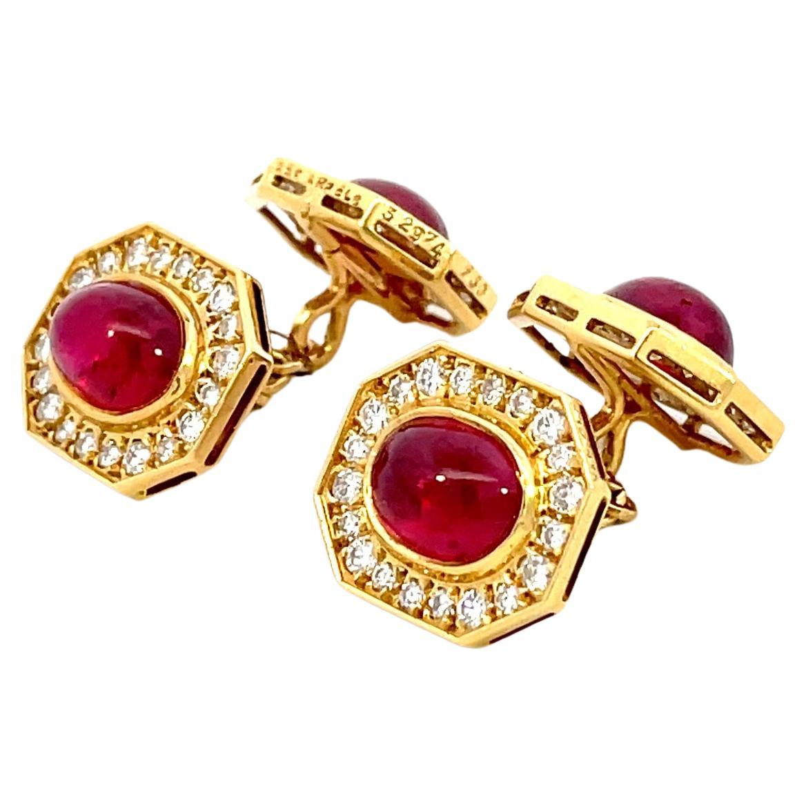 A stunning pair of cufflinks by Van Cleef and Arpels.
4 Bright and gem Quality cabochon cut VIVID-RED rubies (about 2 cts each stone) surrounded by diamond pave (D-E-F color) settled in 18kt yellow gold.
Signed and numbered Van Cleef and Arpels ,