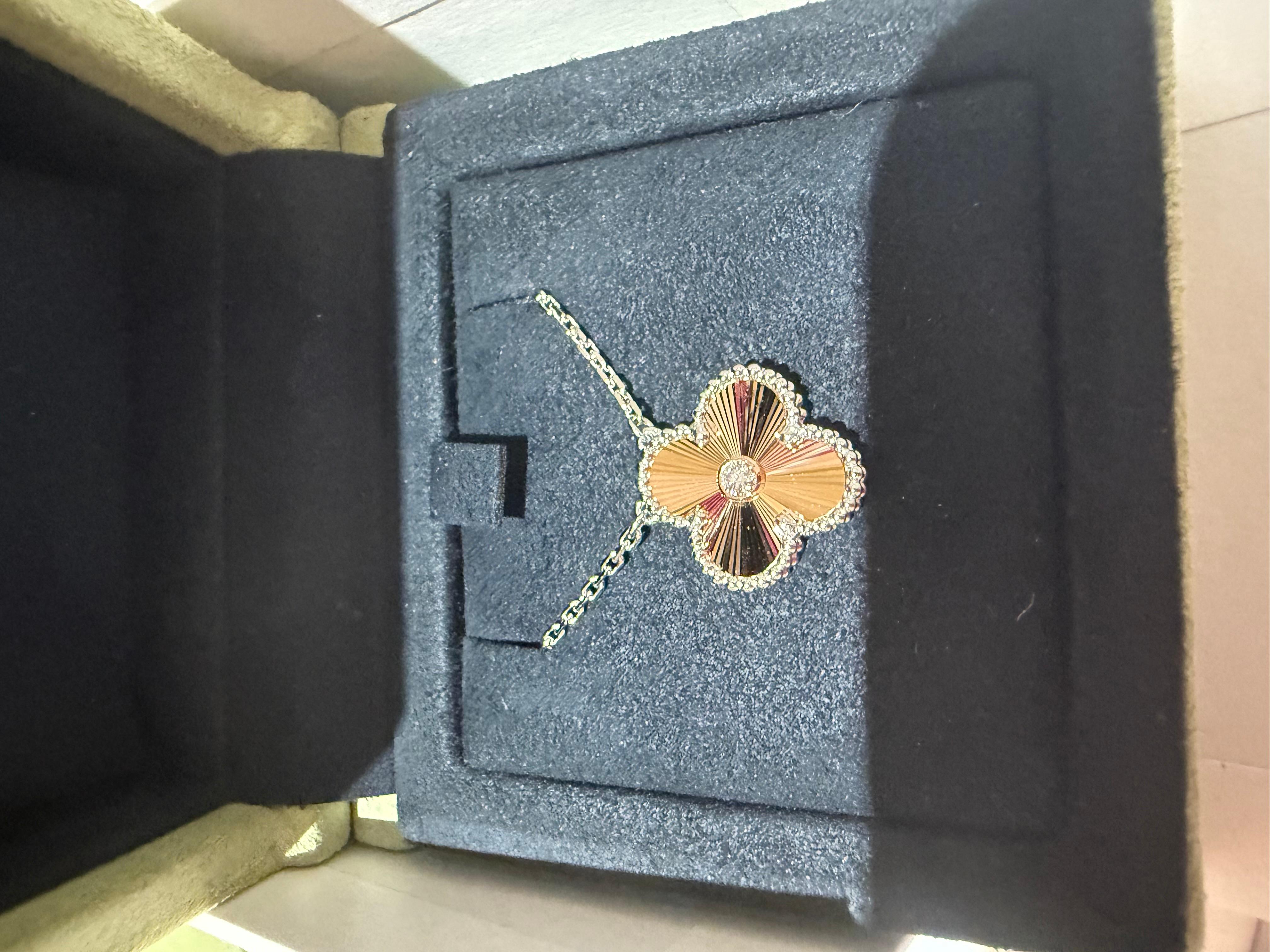Art Nouveau Van Cleef and Arpels holiday Alhambra pendant 2024 in Guilloche