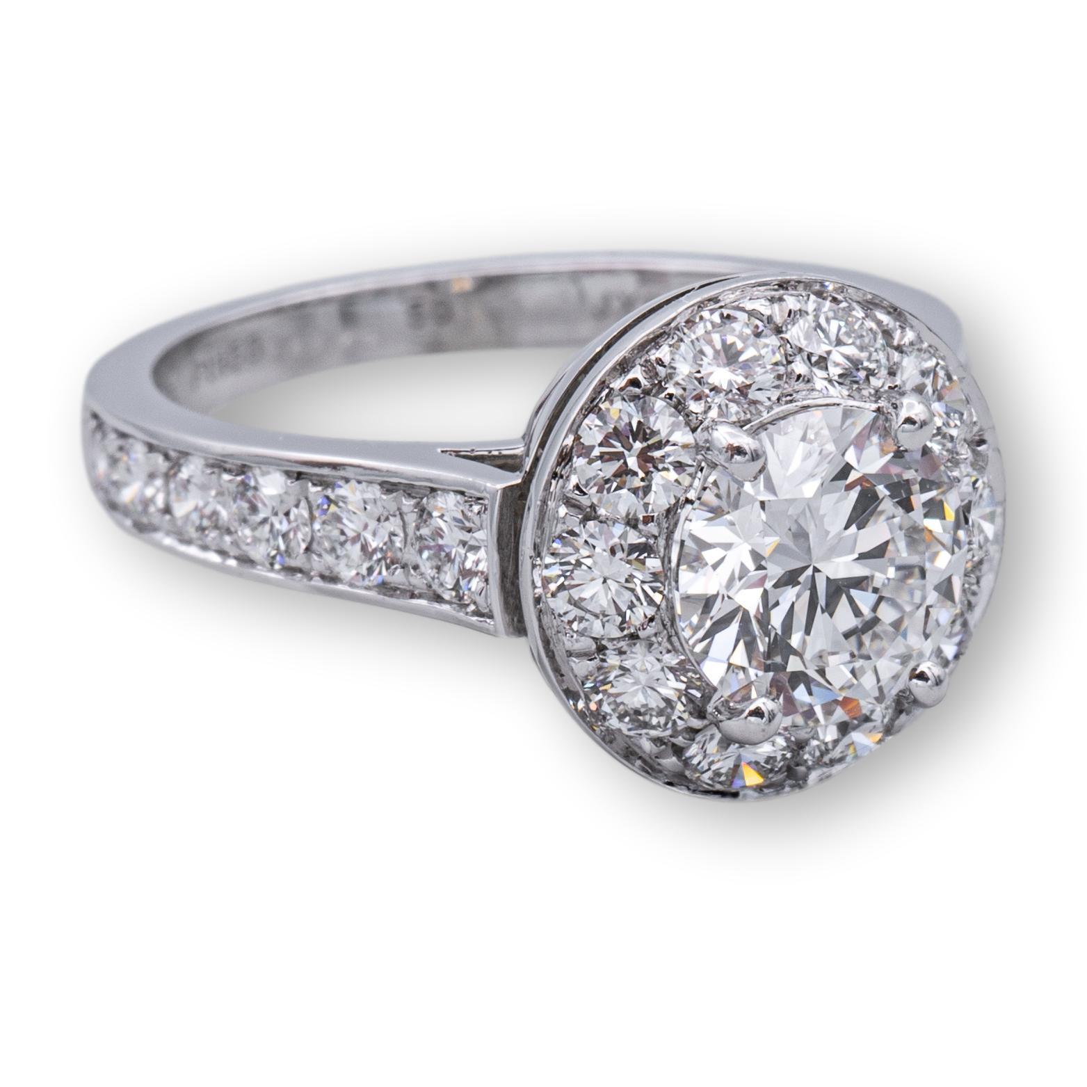 Van Cleef and Arpels engagement ring finely crafted in platinum featuring a round brilliant cut diamond weighing 1.02 carats E color VVS2 clarity , with excellent cut , polish and symmetry. The ring is adorned with a bead set halo and bead set shank