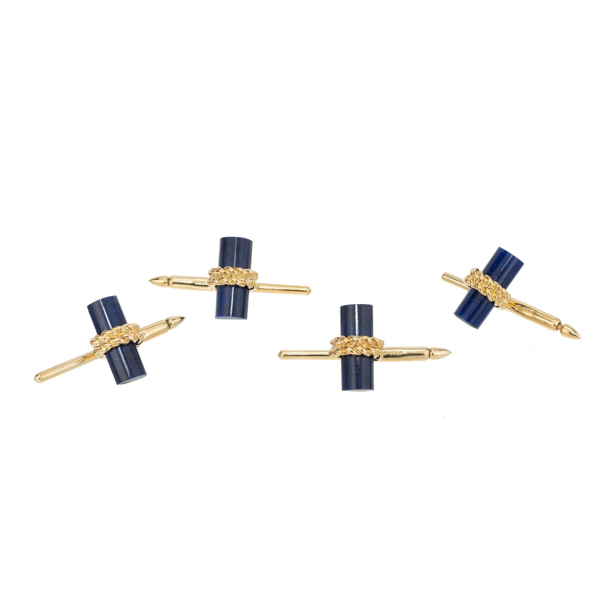 Four piece shirt stud set in lapis and 18k gold from Van Cleef and Arpels. Rare complete four piece set. Van Cleef and Arpels box included.

4 1/2 tubes blue lapis, 12.9 x 5.3 x 3 
18k yellow gold 
Stamped: 18k
Hallmark: VCA NY
9.4 grams
Top to