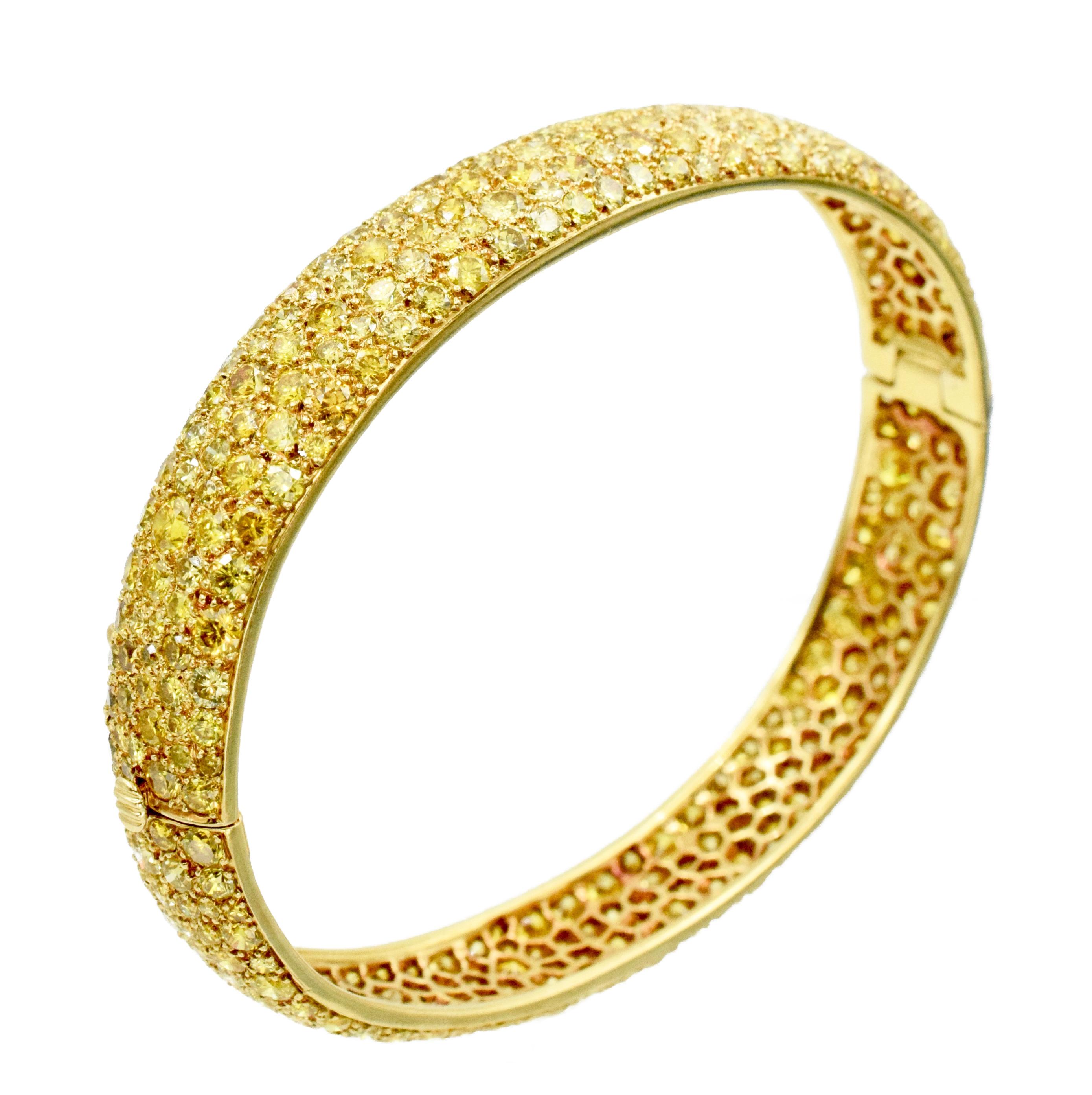 Impressive, Van Cleef and Arpels Yellow diamond bangle bracelet in 18k yellow gold. 
The bracelet is pave set with approximately 12.00c carats of yellow round brilliant cut diamonds.
Signed: Van Cleef & Arpels. Numbered: xxxxx. 
Stamped with French