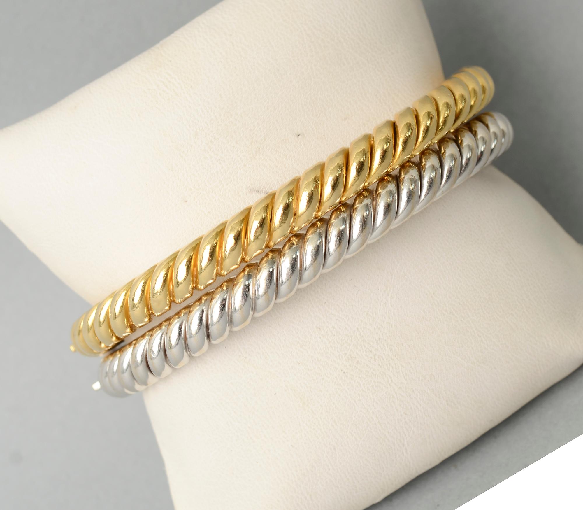 This is a classic pair of twisted gold bangle bracelets by Van Cleef and Arpels. What sets them apart is that one is yellow gold and one is white gold. They make a statement worn either singly or as a pair.
The inside diameter is 2 1/2 inches. The