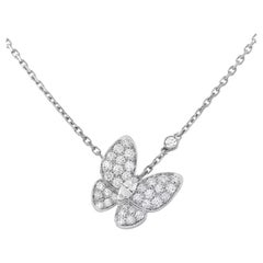 Van Cleef & Arpels Collier pendentif deux papillons avec diamants .88cts